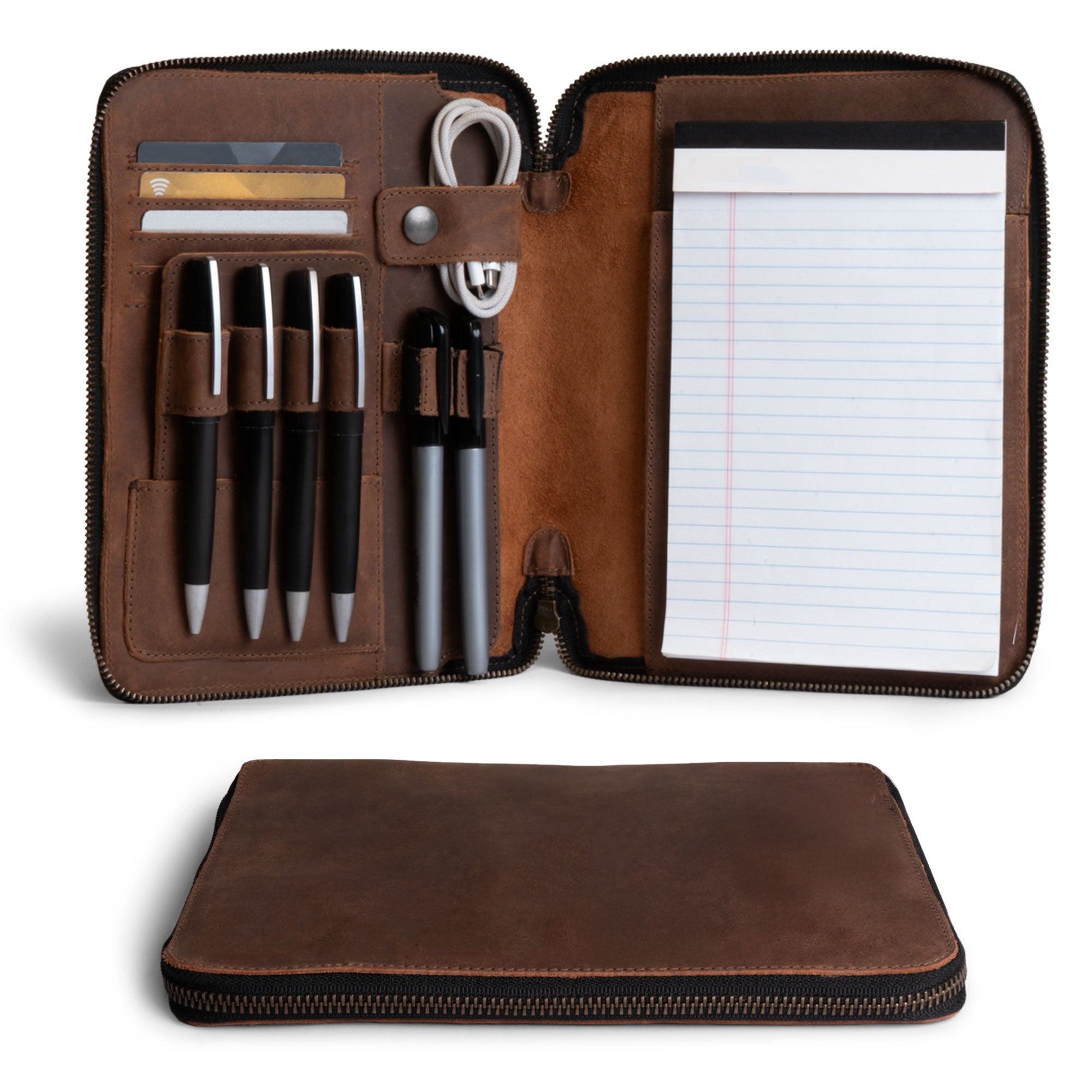 Open Rustic A5 Notebook (5.75 x 8.25 inch.) Portfolio Binder showcasing a cozy inner layout with pens and paper, crafted by Leather Worx. Perfect as an Executive Padfolio for Office or Personal Planner for Men and Women, made from Full Grain Leather, featuring StockyardX quality, Small Batch Production, Hand Cut, Hand Sewn, Fire Branded, Artisan craftsmanship, Handmade in La Antigua Guatemala & Oaxaca Mexico.