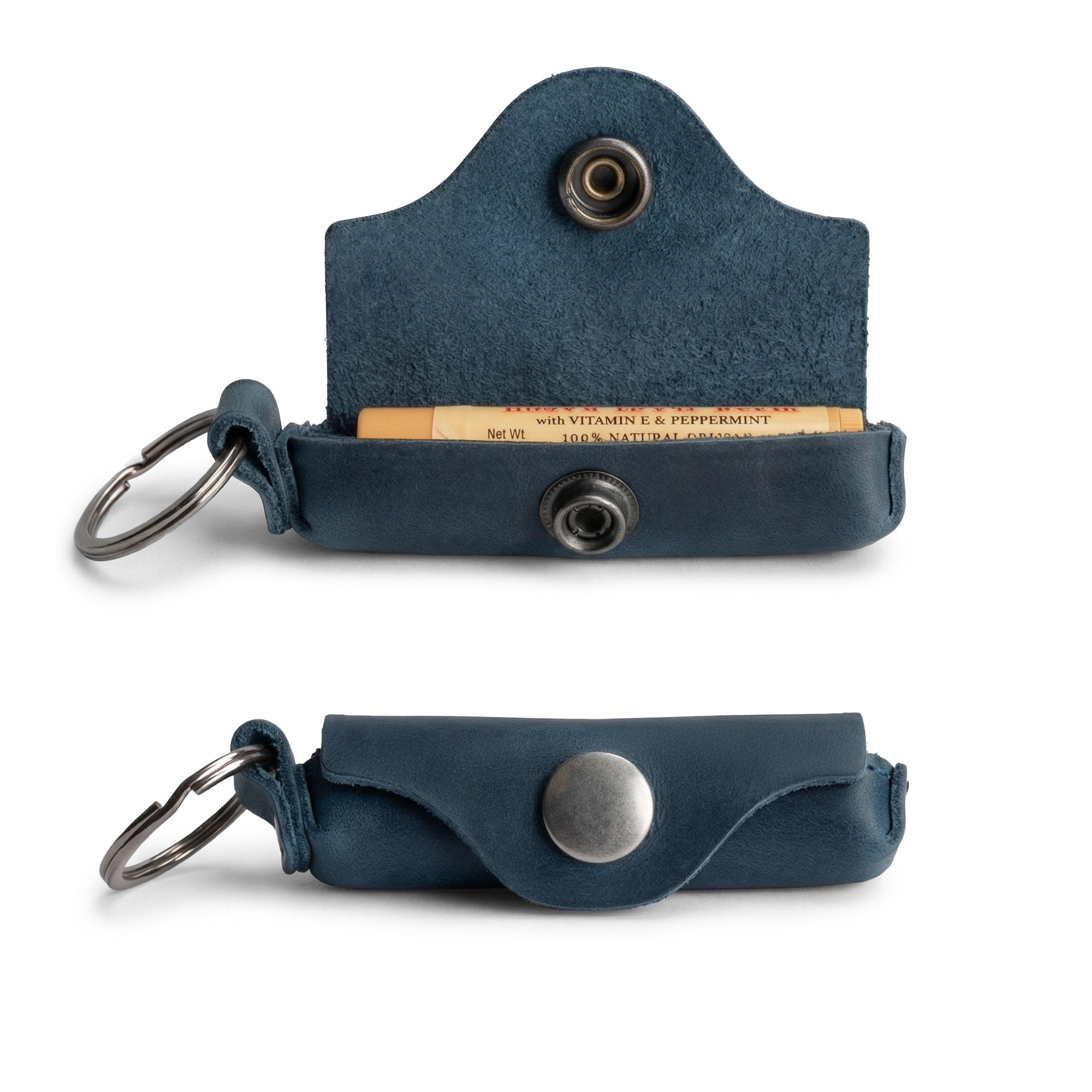 Side view of the Hide & Drink Lip Balm Key Chain with keys attached, demonstrating its functionality as a lip balm keychain holder. Crafted from full grain leather, it elegantly combines style with lip protection.