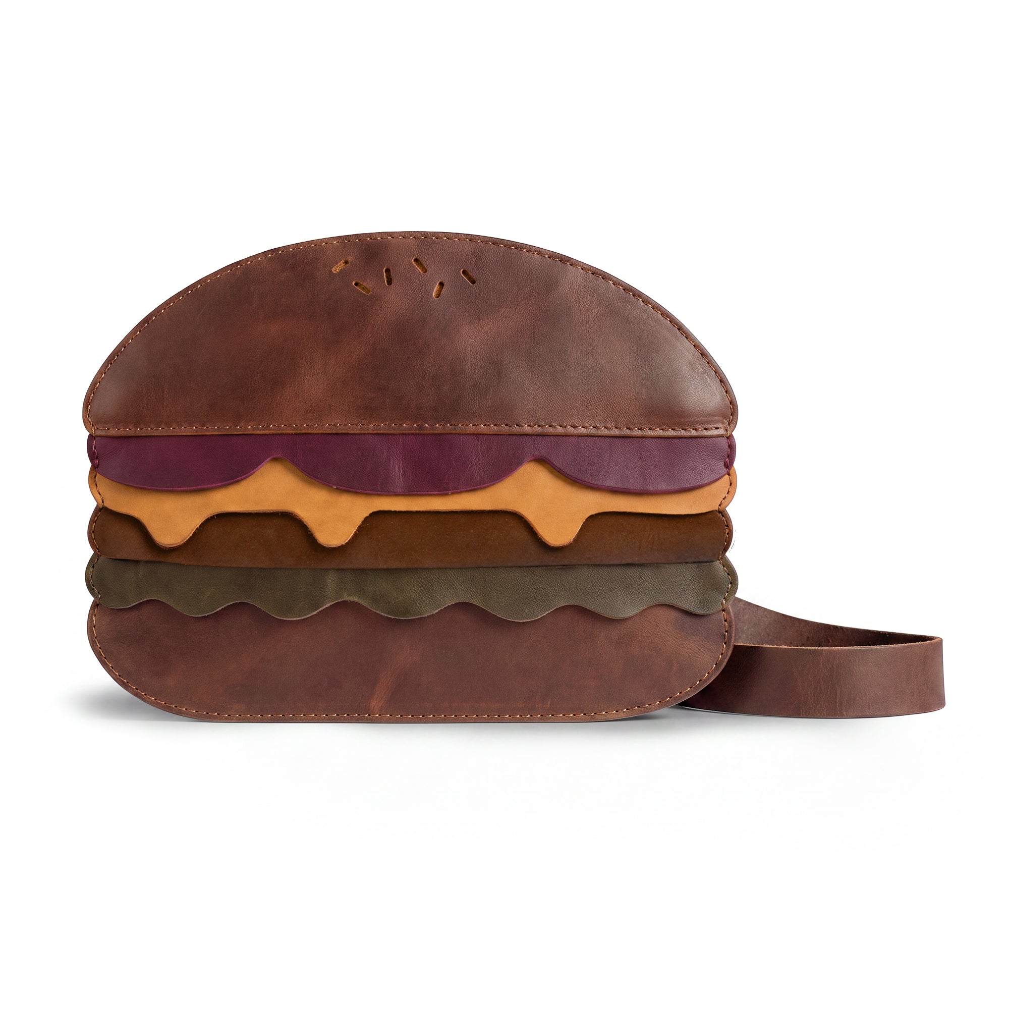 Stylish Burger-Shaped Shoulder Bag featuring vibrant layers, crafted by Tudi Frudi. This unique bag is perfect for adding a fun touch to your outfit while being a practical Travel Accessory. Enjoy its Full Grain Leather texture in this small batch production item, handmade in La Antigua Guatemala & Oaxaca Mexico. Ideal as a Crossbody Bag or Messenger Bag, it's both eye-catching and functional.