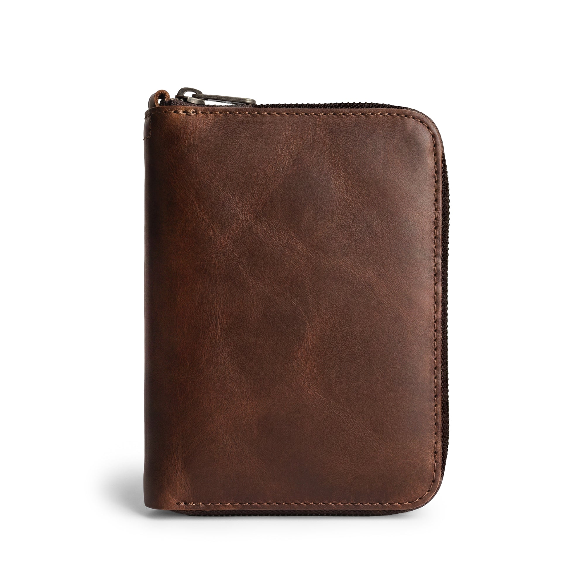 Front view of the Zippered Passport Wallet by Hide & Drink showcasing its rich, brown Full Grain Leather, perfect for stylish travel. Zippered Passport Wallet Handmade from Full Grain Leather - Storage Case for Identification, Credit Cards, Cash Full Grain Leather, StockyardX, Small Batch Production, Hand Cut, Hand Sewn, Fire Branded, Artisan, Handmade in La Antigua Guatemala & Oaxaca Mexico.
