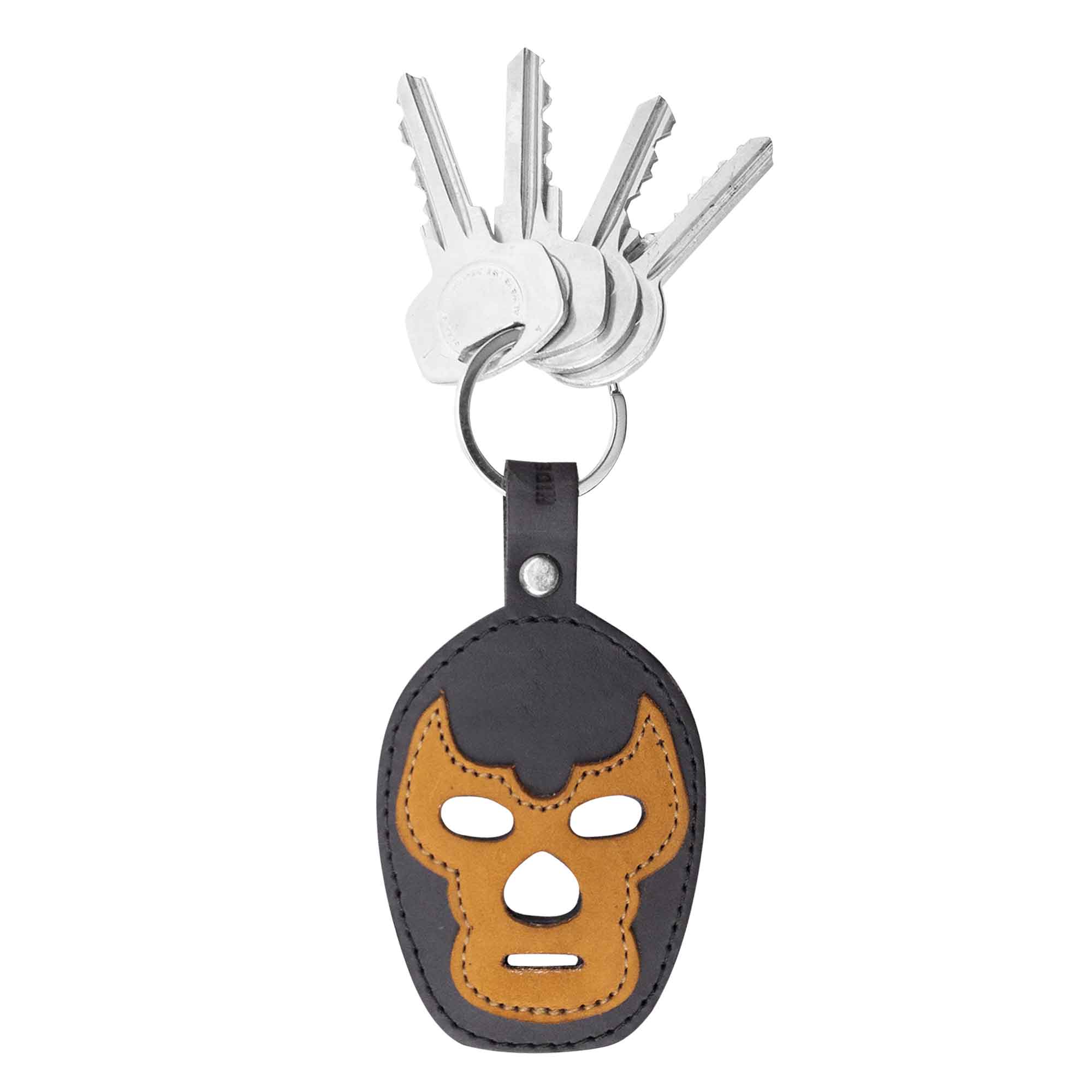 Luchador Mask Leather Keychain in a unique design, perfect for those looking to elevate their keyring game. This key organizer made by Hide & Drink is crafted from high-quality full grain leather, emphasizing artisanal small batch production. Each piece is hand cut, hand sewn, and fire branded in La Antigua Guatemala and Oaxaca Mexico.