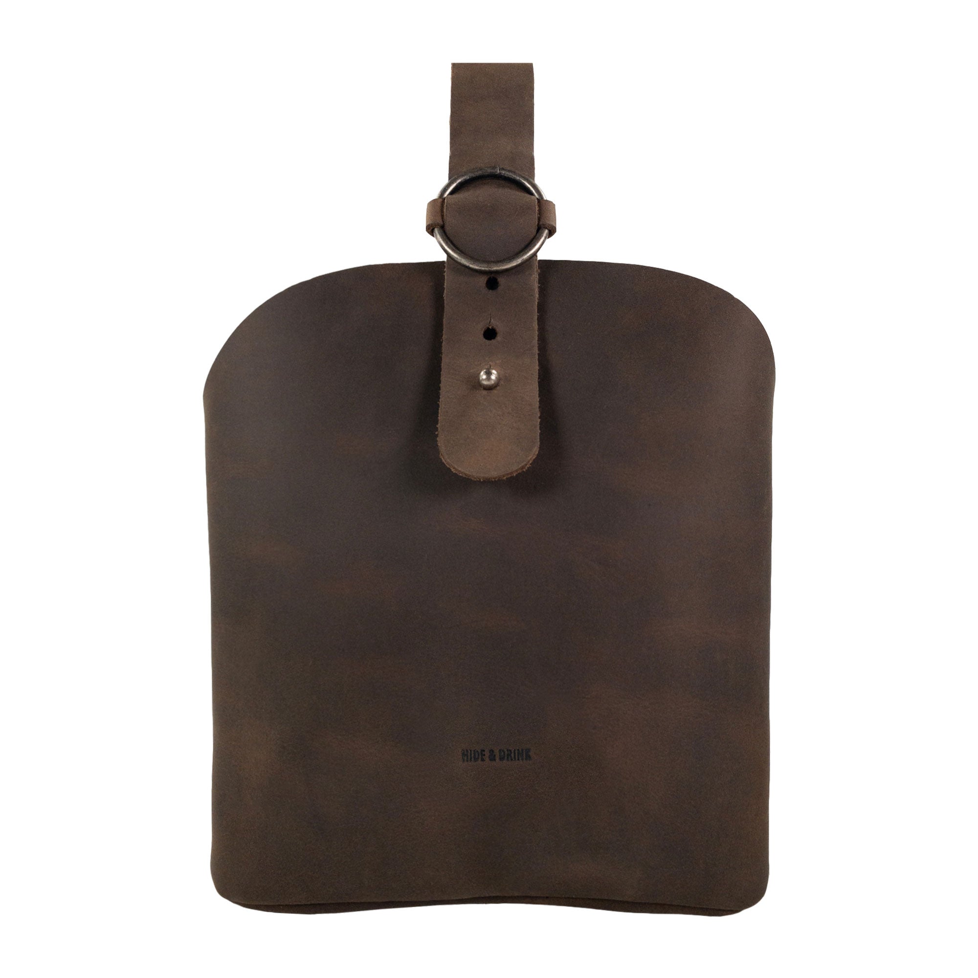 A stylish Rounded Handbag by Hide & Drink showcasing its handcrafted design in full grain leather, perfect as a travel organizer. This artisan piece features hand cut and hand sewn details, highlighting its small batch production and fire branded characteristics, handmade in La Antigua Guatemala & Oaxaca Mexico.