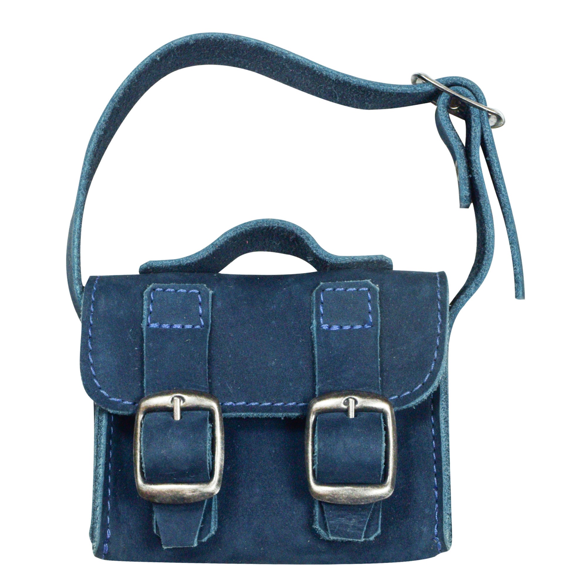 The stylish navy Tiny Messenger Bag by Hide & Drink, an artisan Mini Messenger Bag Charm crafted from robust Full Grain Leather. This accessory is perfect as a keychain or for adding a unique touch to handbags, made with care in La Antigua Guatemala.