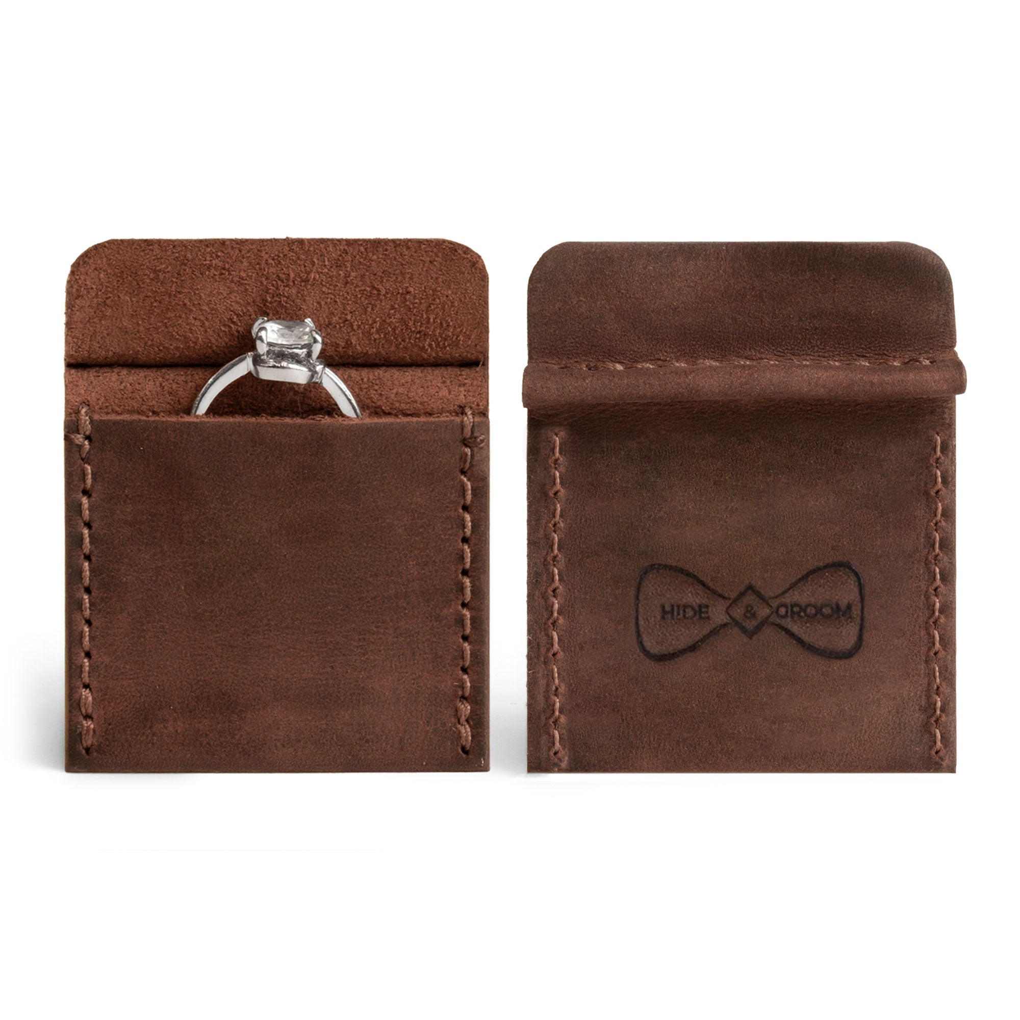 Stylish Wedding Ring Case by Hide & Groom, crafted from Full Grain Leather, showcasing small batch production and artisan craftsmanship. This handmade piece features a durable design, hand cut and hand sewn, fire branded for added elegance. Perfect for keeping your wedding ring safe.
