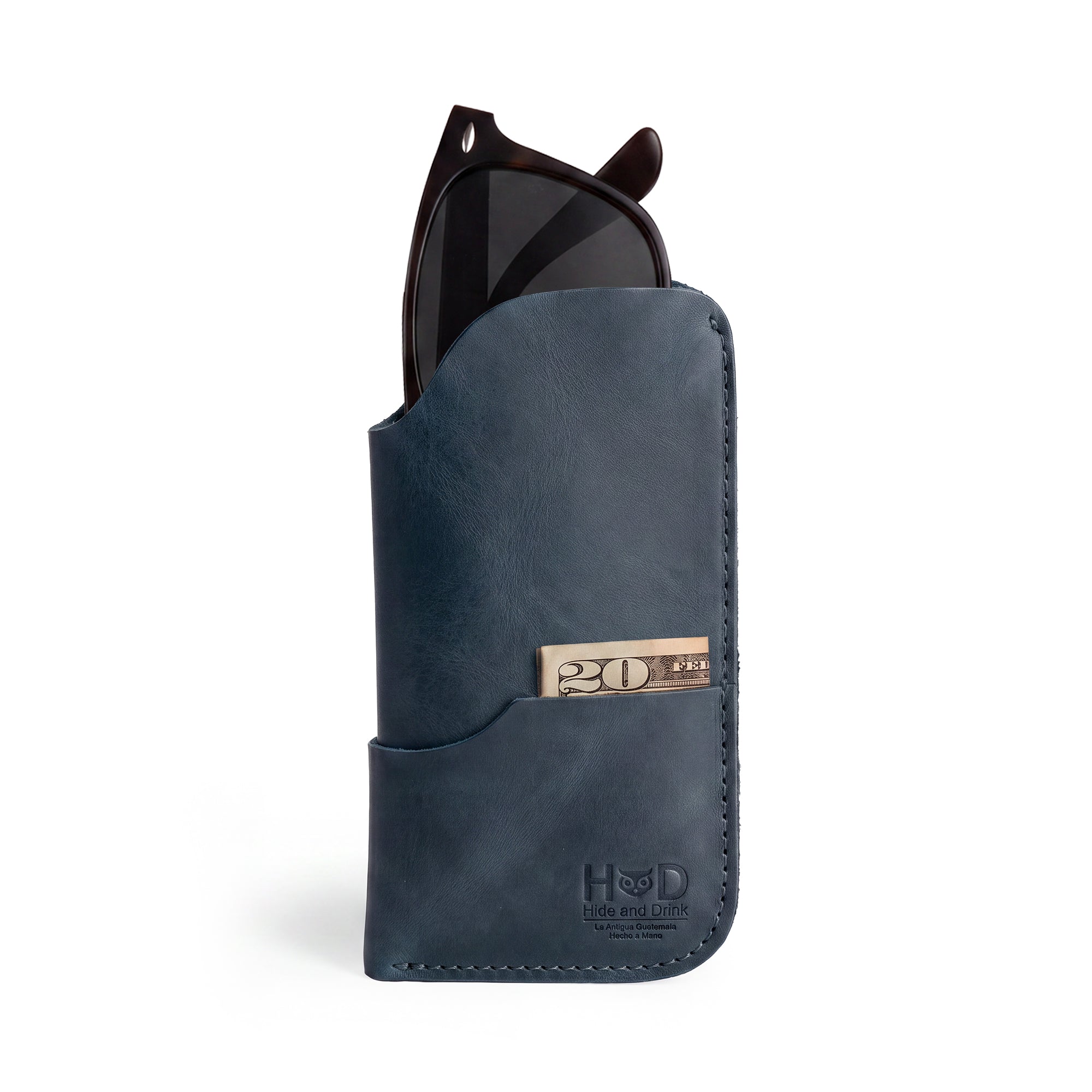The Hide & Drink Sunglass Case & Wallet showcased beautifully, offering practicality and elegance. This Rustic Sunglasses Case & Wallet is crafted from Full Grain Leather, making it a chic glasses protector for travel, produced with care in La Antigua Guatemala & Oaxaca Mexico.