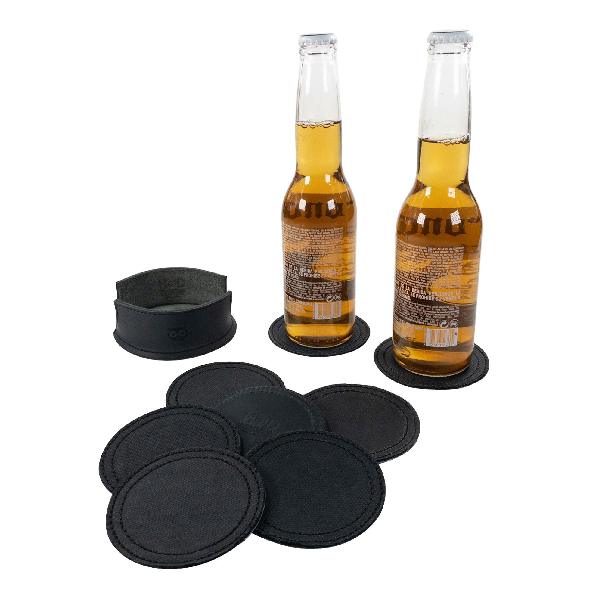 Set of 8 Circular Coasters for Drinks by Hide & Drink featuring two bottles on coasters, crafted from Waxed Canvas and Full Grain Leather. This Circular Set of 8 Coasters for Drinks offers Glass & Cups Stain Protection and showcases the quality of StockyardX with Small Batch Production. Each piece is Hand Cut, Hand Sewn, Fire Branded, and made Artisan, Handmade in La Antigua Guatemala & Oaxaca Mexico.