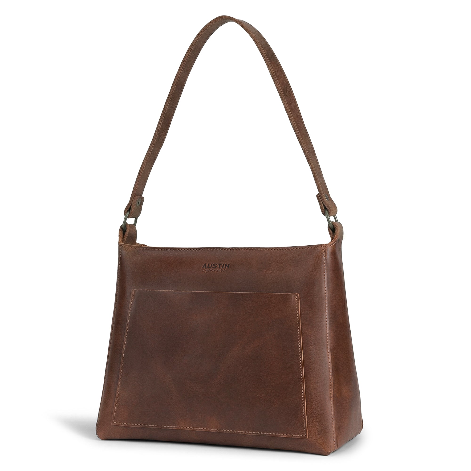 The Allandale Tote Bag, a stylish and practical bag made from full grain leather, showcased by Austin Genuine. This artisan piece features small batch production techniques with hand cut and hand sewn details, fire branded for a unique touch, and is handmade in La Antigua Guatemala & Oaxaca Mexico.