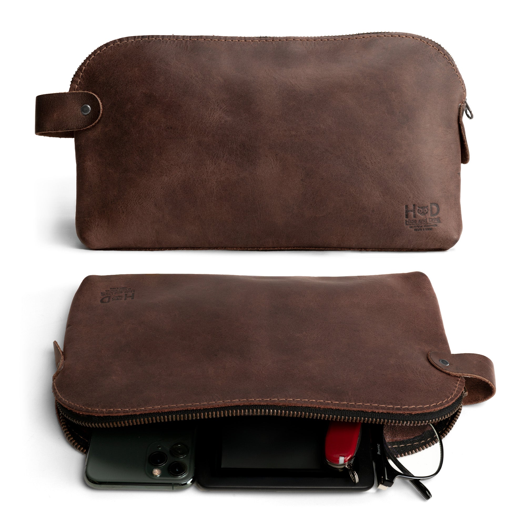 Dopp Kit Utility Bag by Hide & Drink showcasing a large rustic all-purpose Dopp Kit Utility Bag for cords and chargers. This travel bag is made from full grain leather, demonstrating small batch production, hand cut, hand sewn, and fire branded artisan craftsmanship. Handmade in La Antigua Guatemala & Oaxaca Mexico.