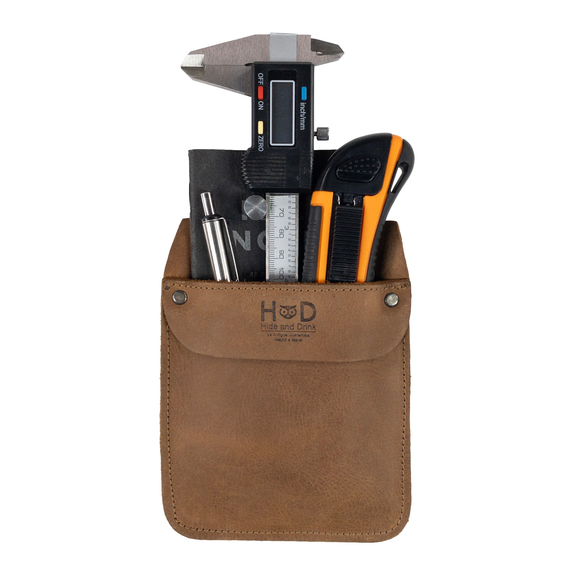 Hide & Drink Leather Work Pocket in a back pocket, emphasizing its compact size for easy carrying. This quality Leather Work Pocket is designed for quick access to tools and supplies.