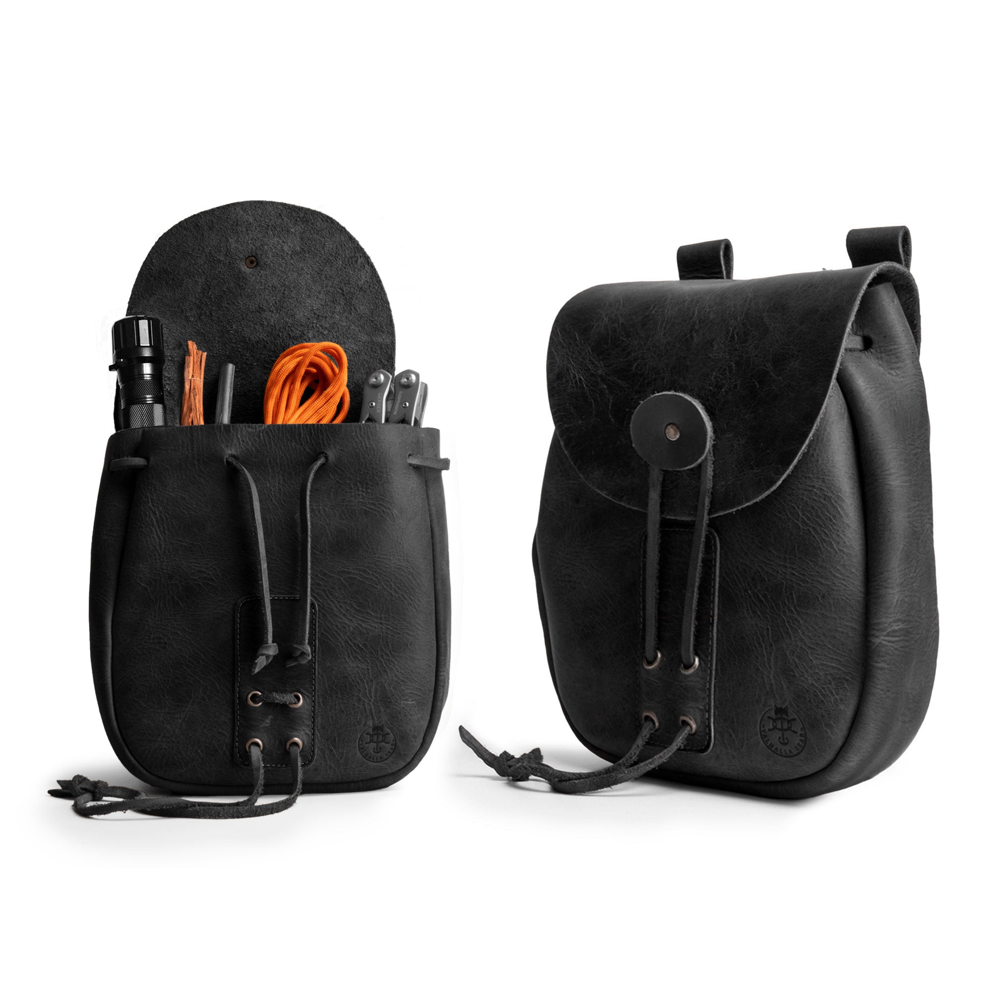 Valhalla Gear Bushcraft Bag in black, featuring tools inside. This portable safe pouch made from full grain leather is designed for securely storing money and other valuables, showcasing artisan craftsmanship.