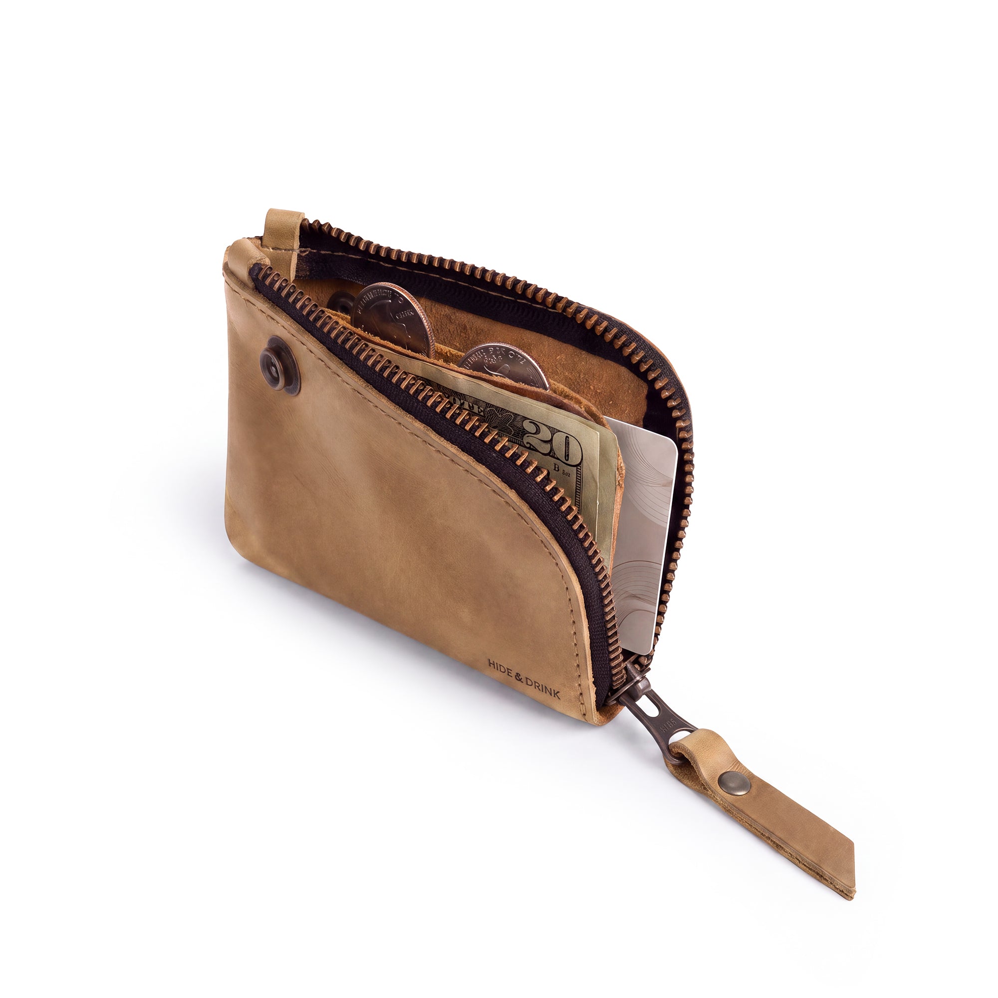 Close-up of the Lion's Mane Zippered Wallet by Hide & Drink highlighting the hand-stitched details and durable construction ideal for travel essentials.