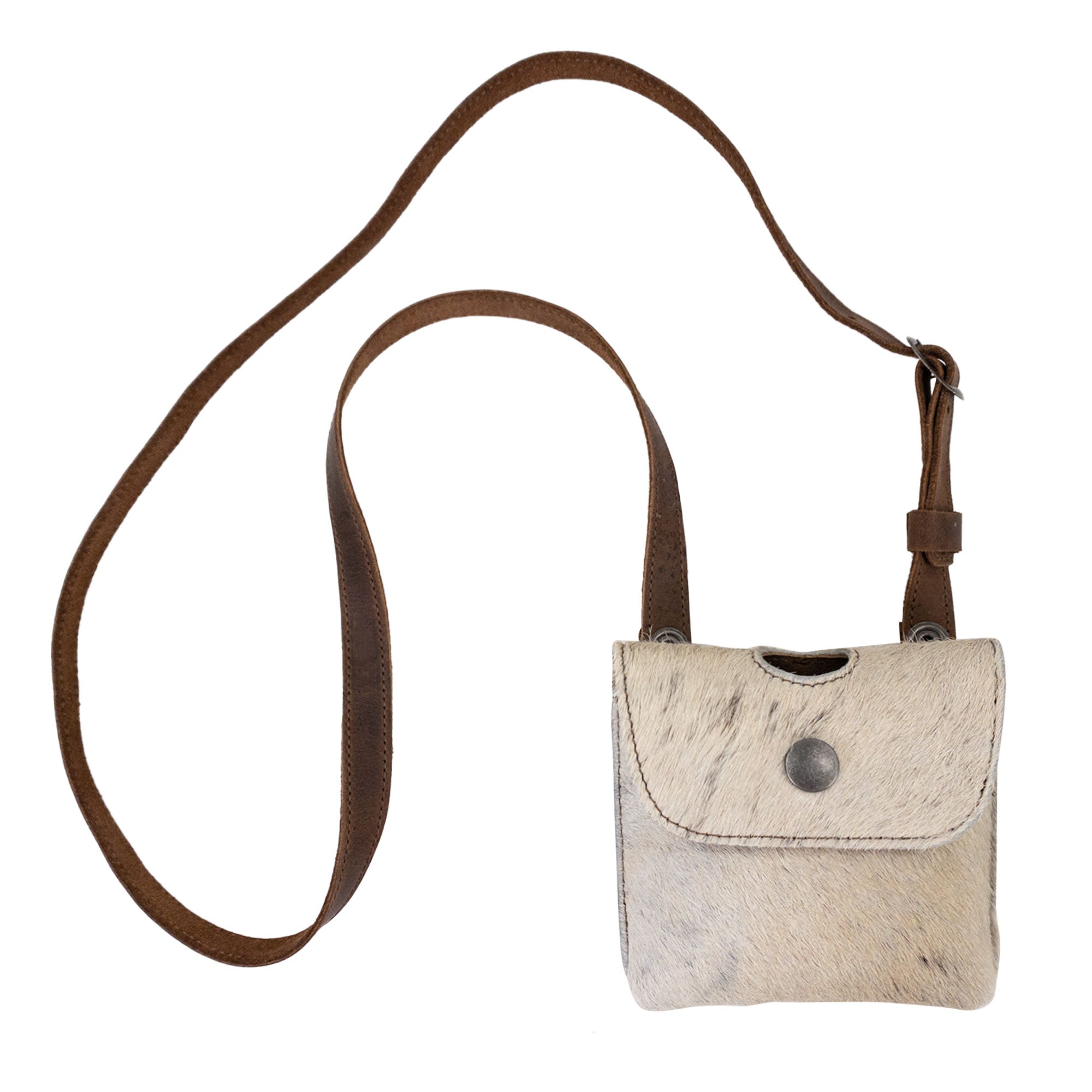 A stylish Liquor Flask Holder made from Hair On Hide Full Grain Leather, crafted by Western Leather Works. This artisan piece features a small size, perfect for discreet carrying. Please note, bottle not included. Enjoy its quality as part of small batch production with hand cut and hand sewn details. Fire branded for authenticity, this product embodies the spirit of handmade craftsmanship in La Antigua Guatemala & Oaxaca Mexico.