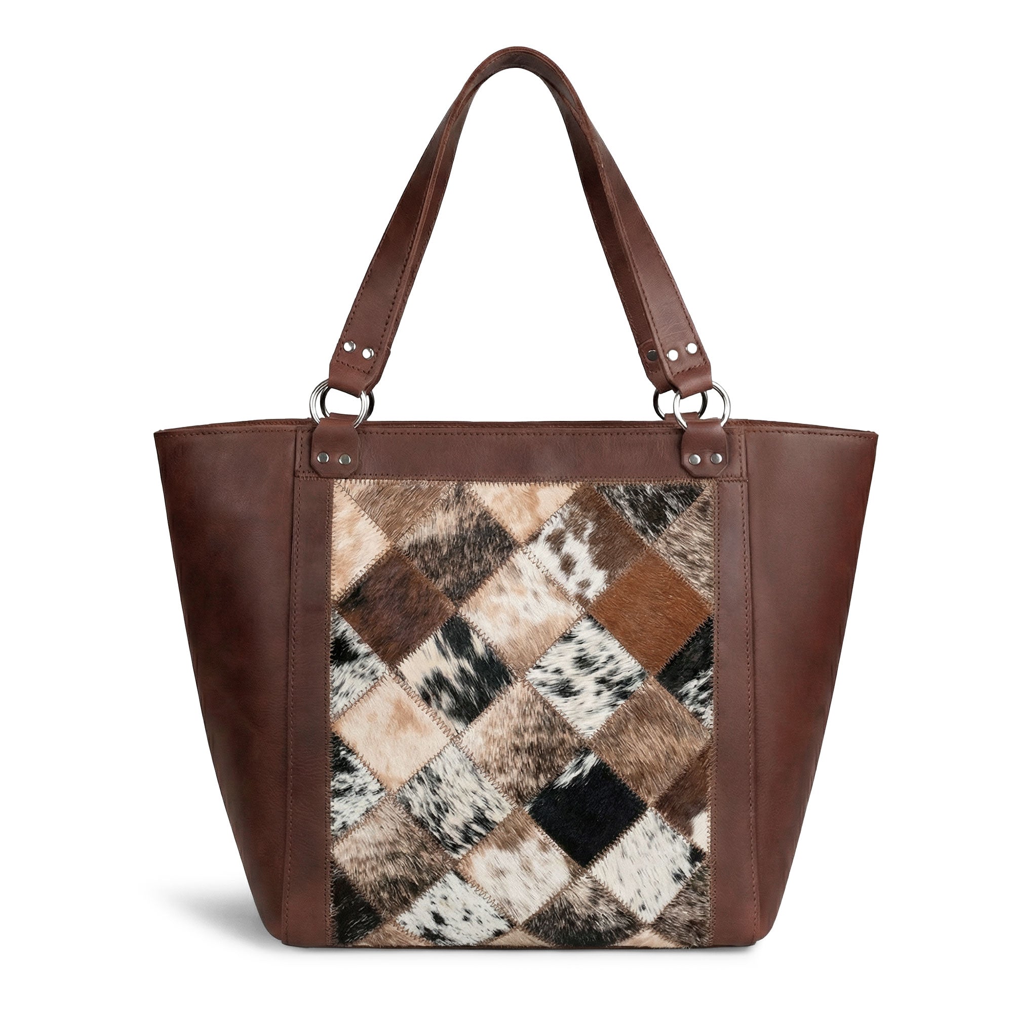 The Leather Formal Handbag by Hide & Drink displayed with personal items, showcasing its practicality. This Full Grain Leather handbag is ideal for use as a Female Formal Handbag, Shoulder Bag, or Shopping Bag for girls. Handmade in La Antigua Guatemala & Oaxaca Mexico.