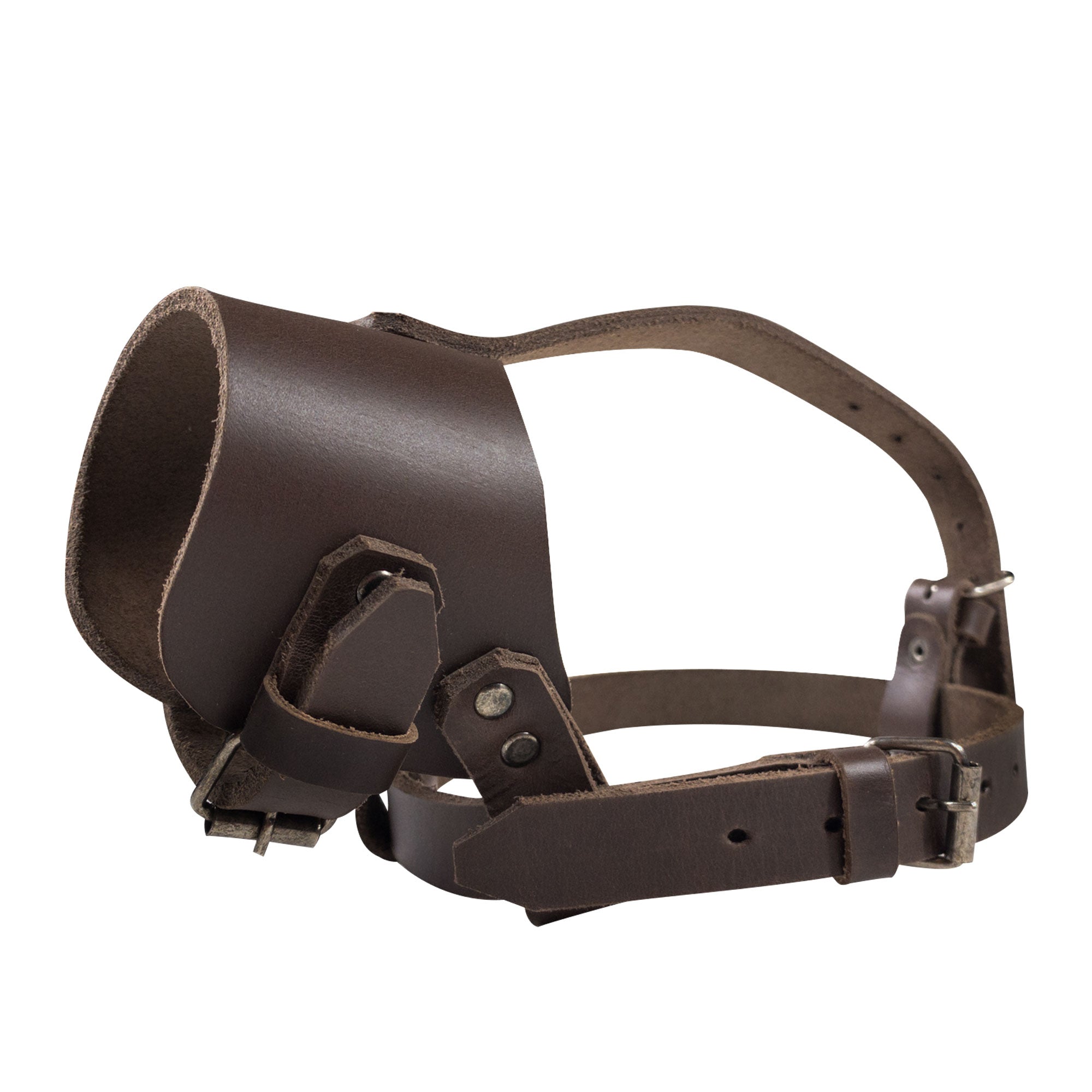 Anti Bite Dog Muzzle by Taco Dog featuring a rustic dog muzzle guard with adjustable straps for secure training. This mouth guard mask prevents biting and chewing, crafted from full grain leather, showcasing small batch production with hand cut and hand sewn details. Handmade in La Antigua Guatemala & Oaxaca Mexico.