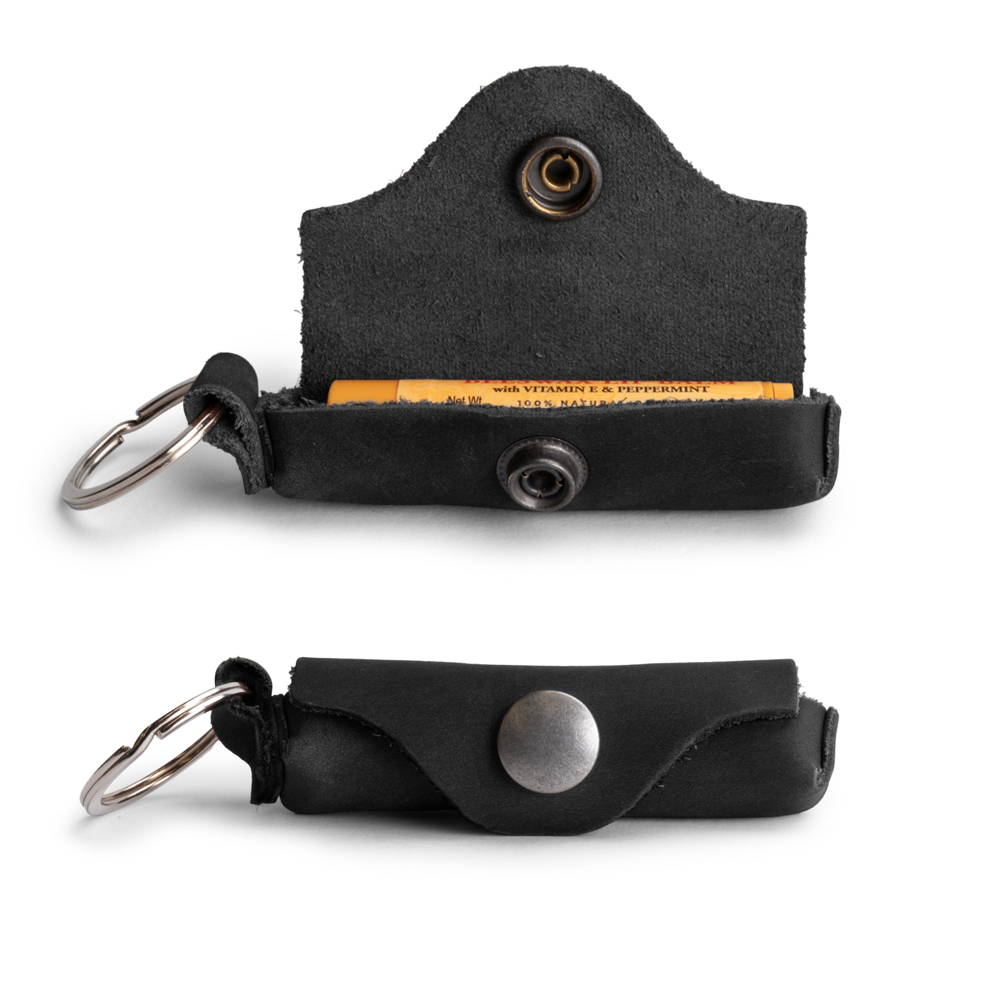 Multi-functional Lip Balm Key Chain by Hide & Drink showing an open design for easy access to lip balm. Classic vintage style crafted from durable full grain leather, made in La Antigua Guatemala.