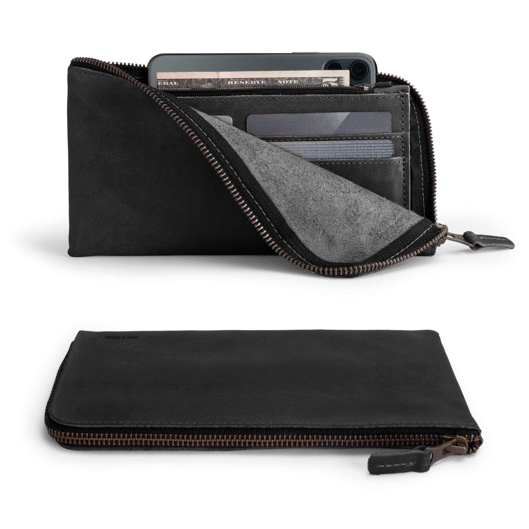Open view of the Large Zippered Wallet by Hide & Drink in Charcoal Black, featuring its organization capabilities. This Long Zippered Wallet for Men and Women doubles as a Card Holder, Card Organizer, and Bill Holder, serving as a practical Travel Accessory. Crafted with Full Grain Leather and handmade in La Antigua Guatemala & Oaxaca Mexico, it embodies artisan craftsmanship.