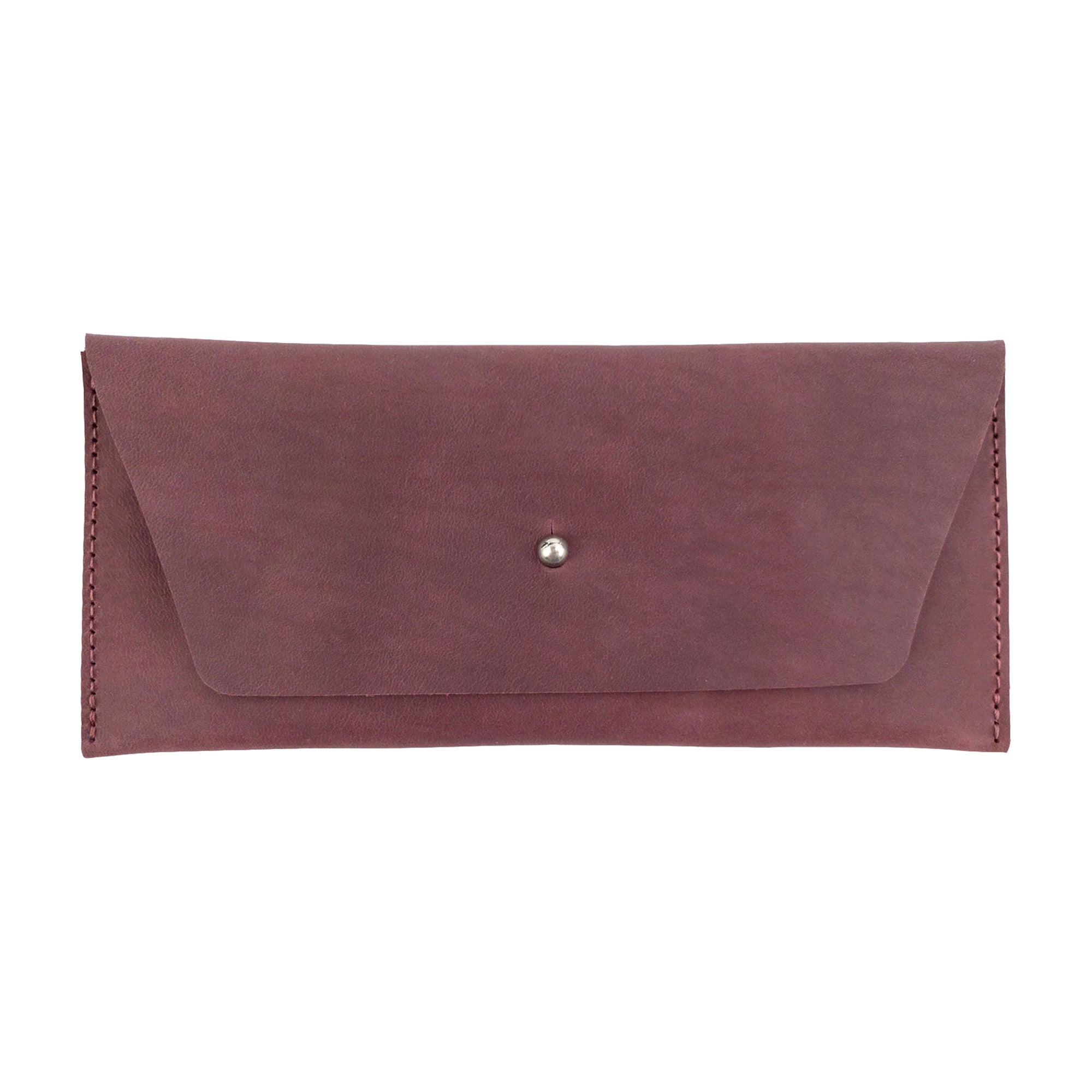 The Long Utility Pouch by Hide & Drink in an earthy tone, emphasizing its rustic charm and craftsmanship. Ideal for stylishly keeping cash, coins, and cards.