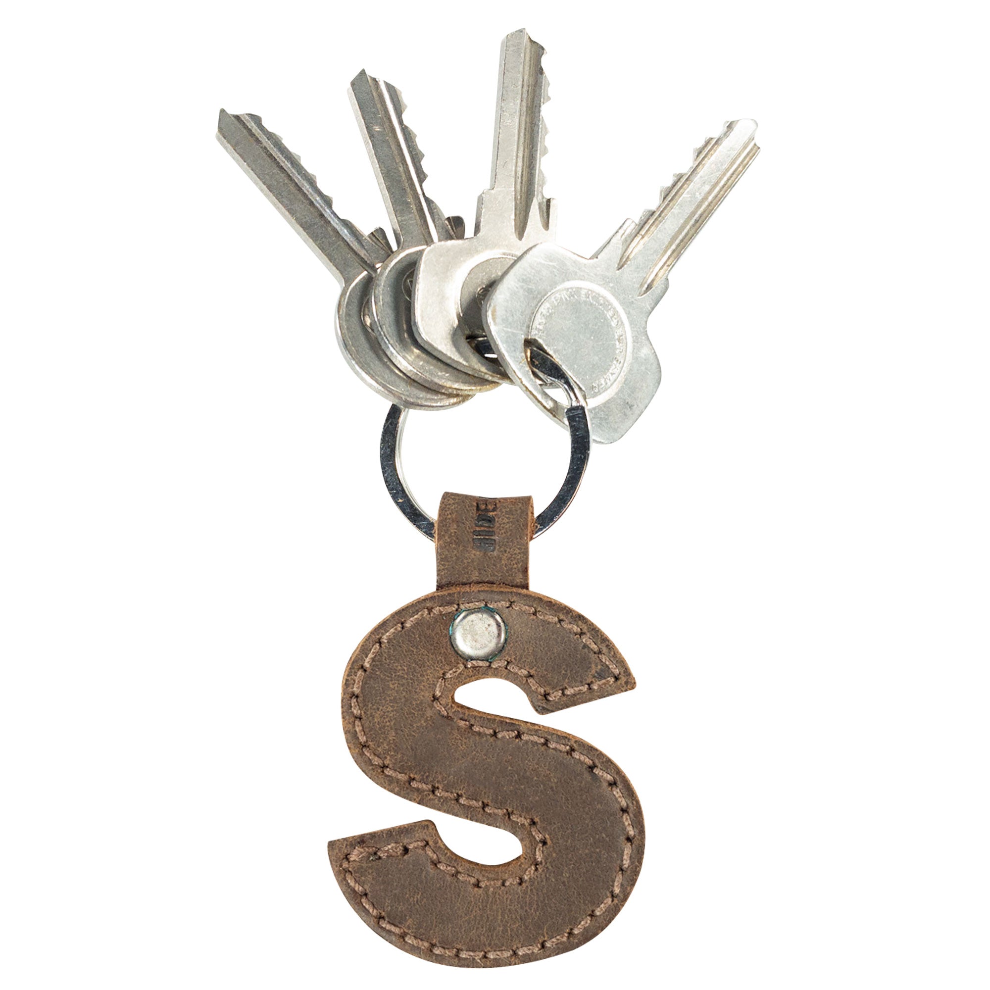 Letter S keychain from Hide & Drink, emphasizing its strong design in thick Full Grain Leather. This Alphabet Letter Keychain reflects small batch artisan production from La Antigua Guatemala.