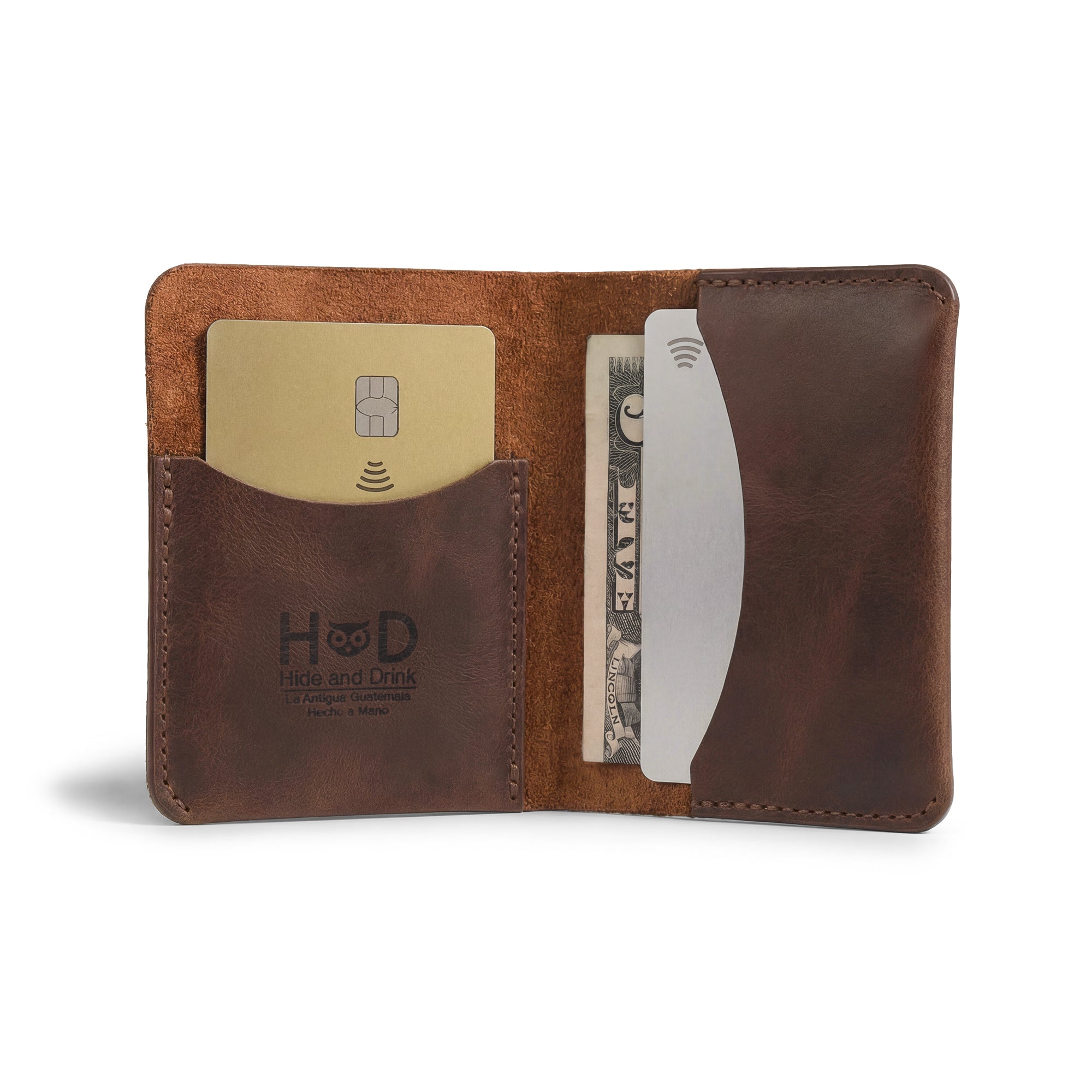 Hide & Drink's Bifold Slim Card Holder features a sleek design for credit card storage and cash organization. Made from full grain leather, this minimalist wallet is hand cut and hand sewn, a perfect choice for those who appreciate artisan craftsmanship. Ideal for everyday use, it's a practical cash case that embodies small batch production and artisan quality from La Antigua Guatemala.