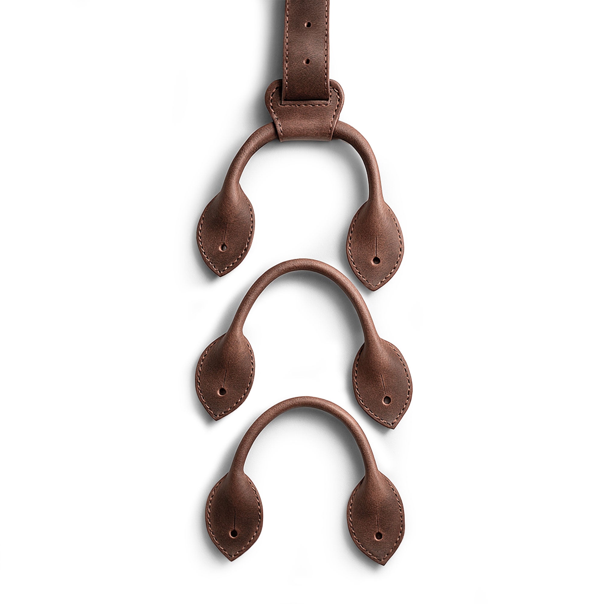 Set of 3 Button End Attachments for Suspenders by Hide & Groom, showcasing full grain leather craftsmanship. Perfect for groomsmen, best men, and wedding ceremonies. This artisan product features small batch production, hand cut and sewn techniques, and is proudly handmade in La Antigua Guatemala.