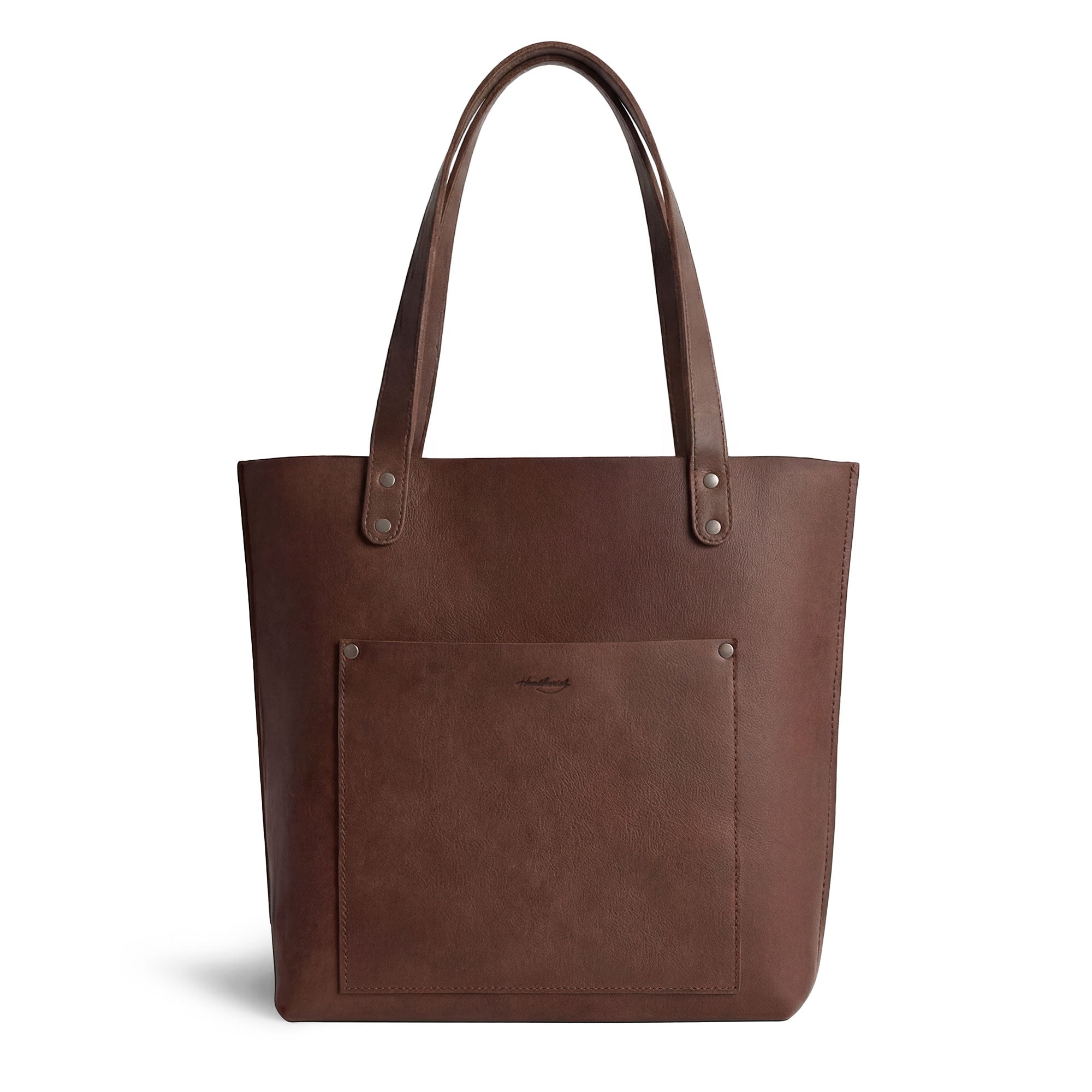 Heather's Minimalist Tote Bag With Pouch showcased in rich full grain leather, perfect for any outfit. Classic Tote Bag Shoulder Bag for Women with Pouch, handcrafted in La Antigua Guatemala. This artisan piece exhibits small batch production with hand cut, hand sewn details.