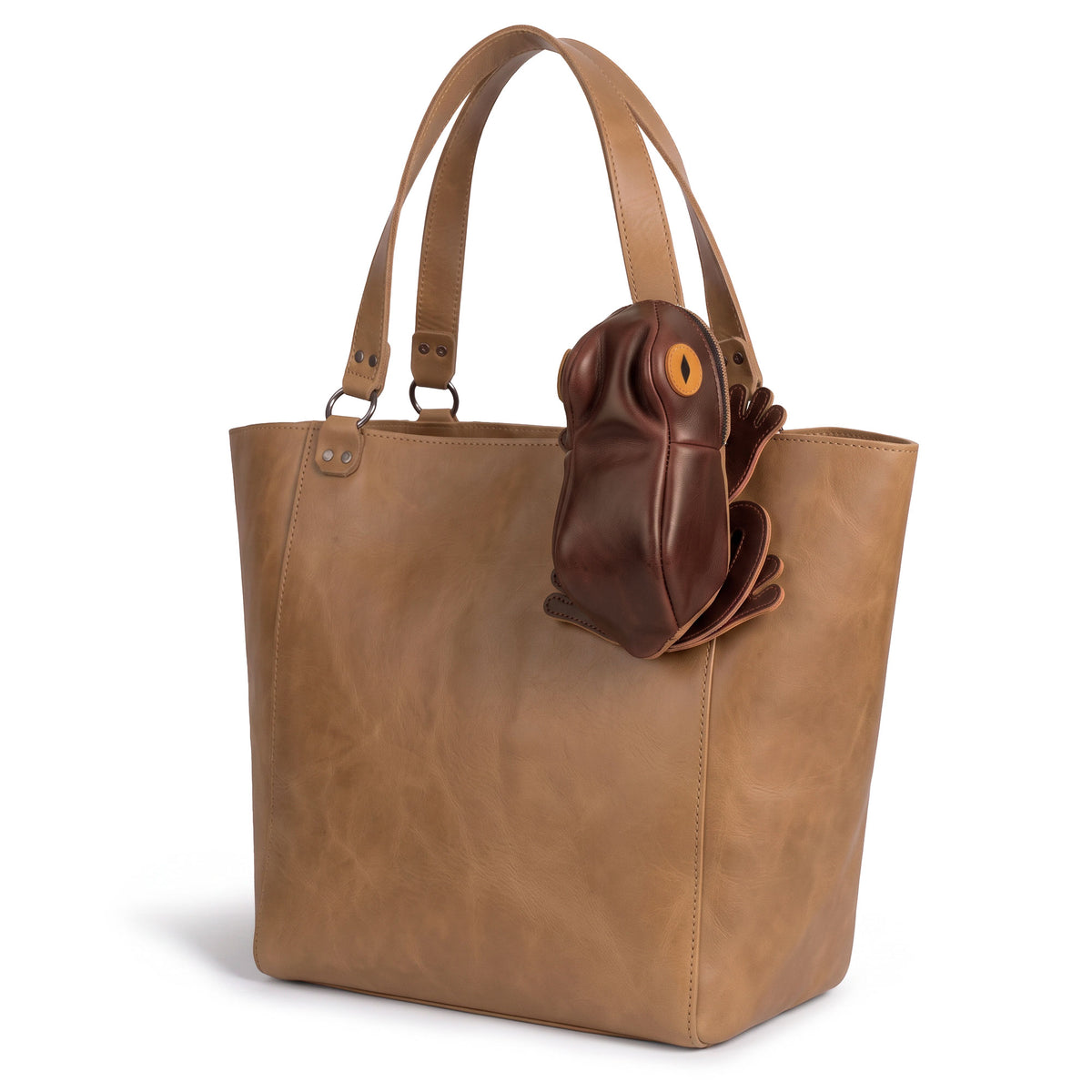 Tudi Frudi Frog Pouch, a Frog-Shaped Pouch attached to a leather tote, shown as a Cable Organizer and Small Accessory Case; Zippered Cash Holder Wallet for Coins and Change Purse, designed as Pouches for Men and Women. Made from Full Grain Leather by StockyardX using Small Batch Production, Hand Cut and Hand Sewn craftsmanship, Fire Branded by Artisan makers, Handmade in La Antigua Guatemala & Oaxaca Mexico.