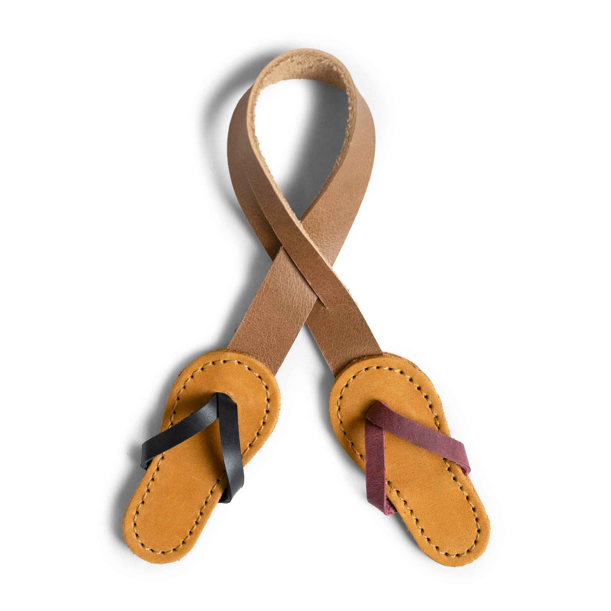 Hide & Drink Bag Charms showcasing a charming flip flop design, ideal for handbags. This decorative charm serves as a purse charm for tote & backpacks, crafted from full grain leather. Each piece embodies StockyardX's small batch production, highlighting the meticulous hand cut, hand sewn artistry and fire branded touches, handmade in La Antigua Guatemala & Oaxaca Mexico.