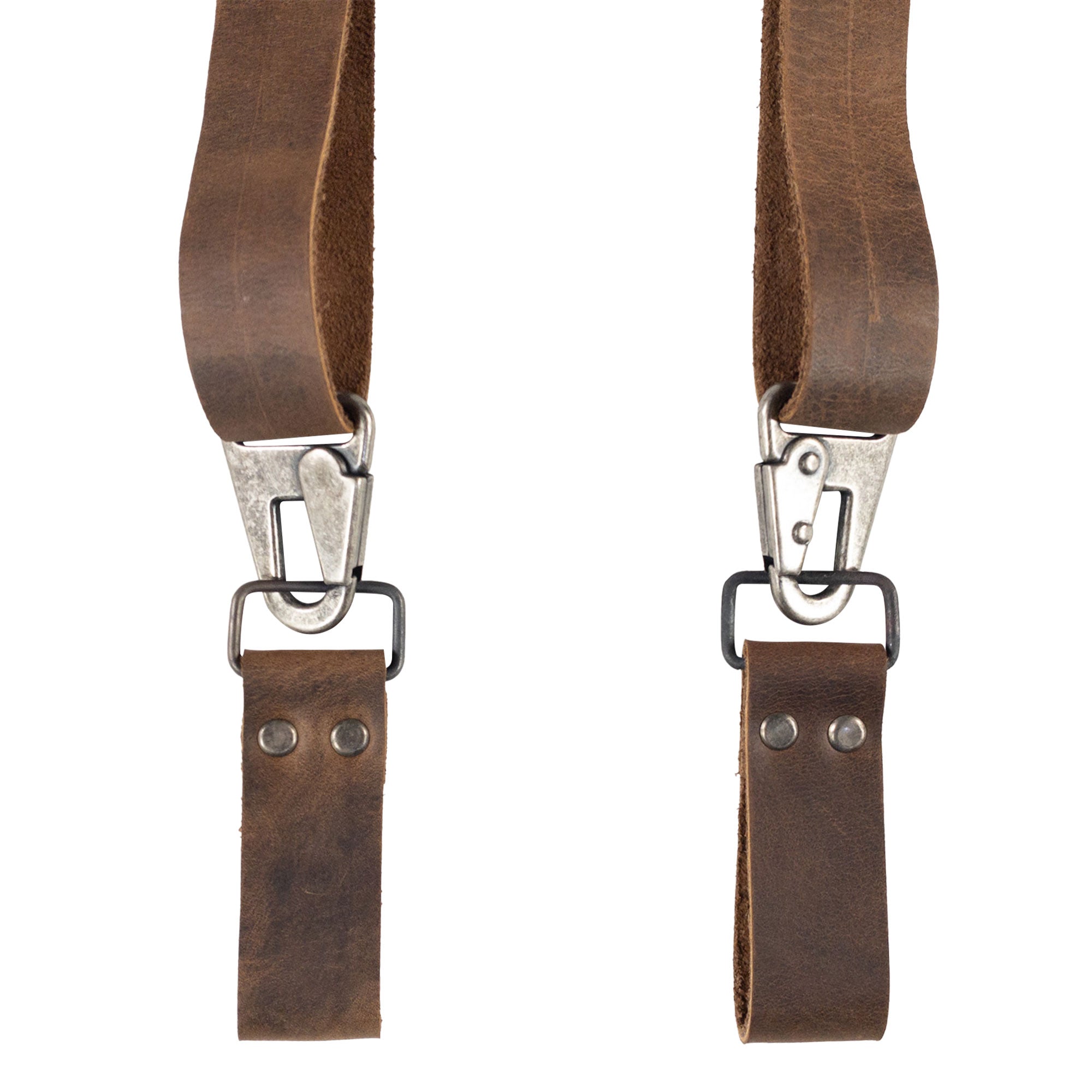 Close-up of Set of 2 Riveted Suspender Loop Attachments by Hide & Groom, highlighting the durable full grain leather and metal clips. Ideal for men seeking quality wedding accessories, these heavy-duty, handmade items represent artisan craftsmanship from La Antigua Guatemala & Oaxaca Mexico.