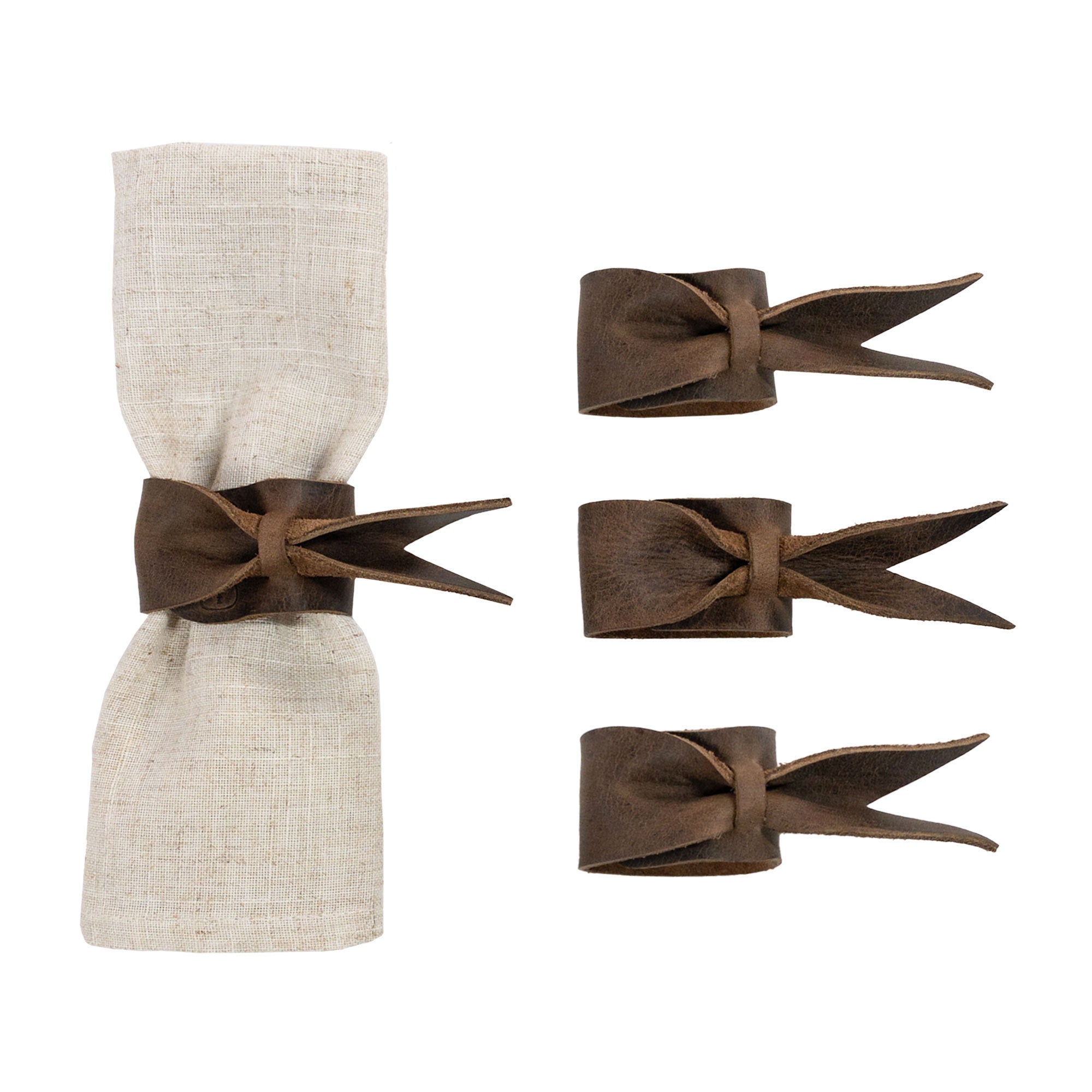 Elegant Set of 4 Napkin Rings for Weddings by Hide & Groom, showcasing leather napkin rings with a bow design. Perfect for wedding receptions, dinner party decoration, crafted from full grain leather with small batch production techniques. Handmade in La Antigua Guatemala & Oaxaca Mexico.