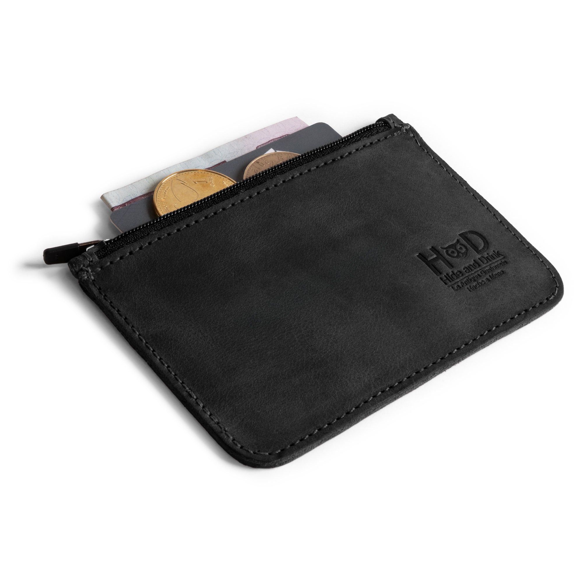 Back view of a black Hide & Drink zippered wallet, highlighting its elegant full grain leather texture. This stylish card case is ideal for anyone seeking functional travel accessories while appreciating artisan craftsmanship.