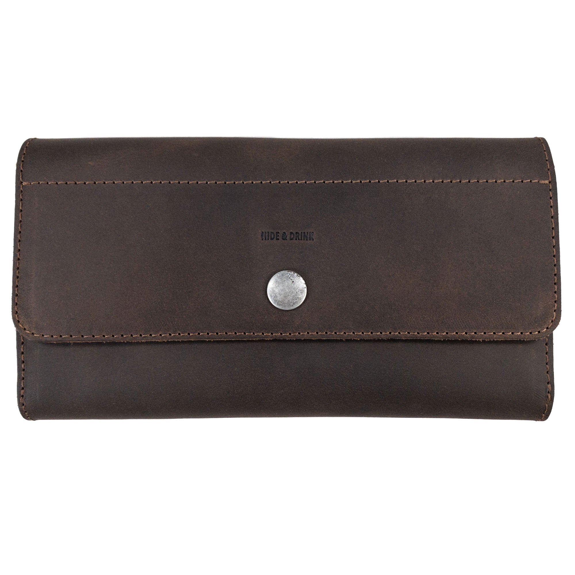 Rustic Tri Fold Folio Wallet by Hide & Drink, showcasing a sleek exterior design made from full grain leather. This Minimalist Tri Fold Folio Wallet for Women features small batch production, hand cut and hand sewn craftsmanship, making it a perfect artisan piece handmade in La Antigua Guatemala & Oaxaca Mexico.