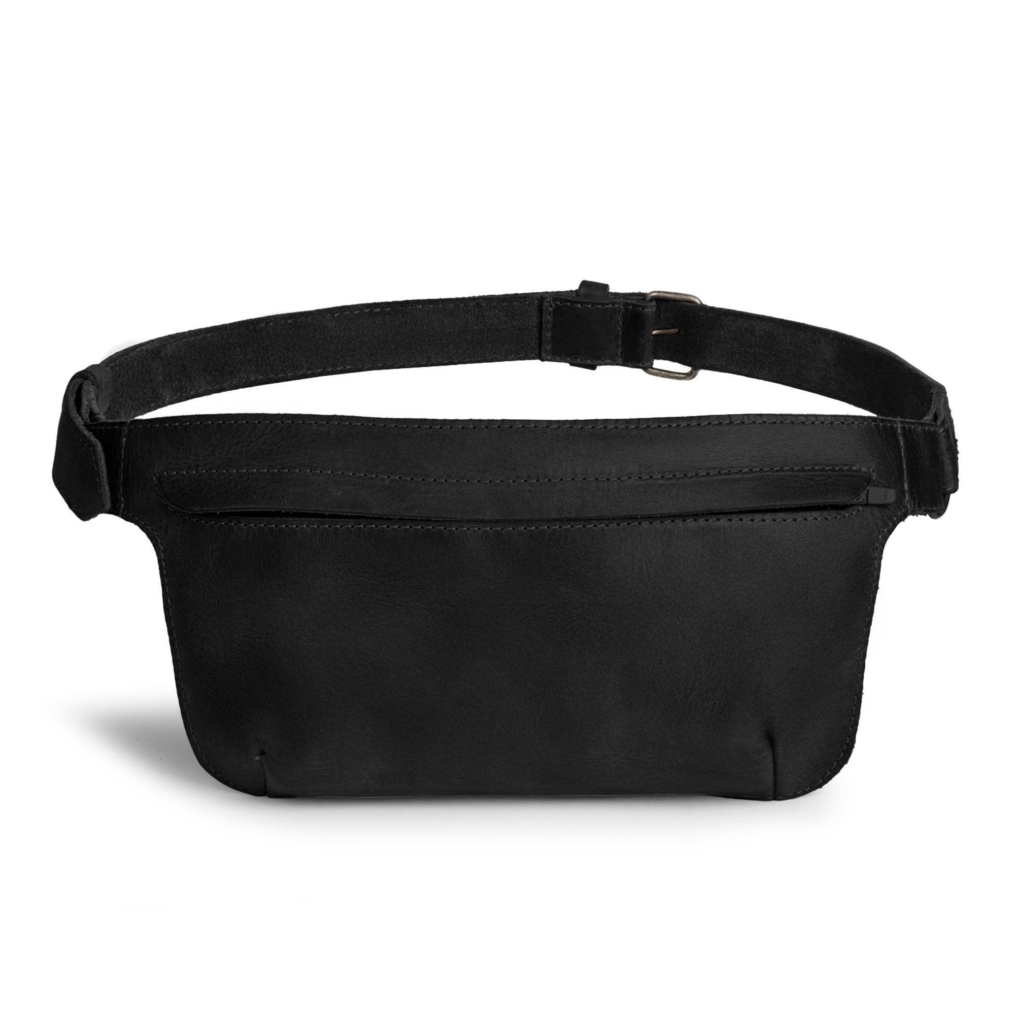 Slim Fanny Pack by Hide & Drink in black leather, exemplifying a stylish rectangular design with an adjustable strap, perfect for carrying essentials like a phone. This handmade accessory is part of small batch artisan production in La Antigua Guatemala.
