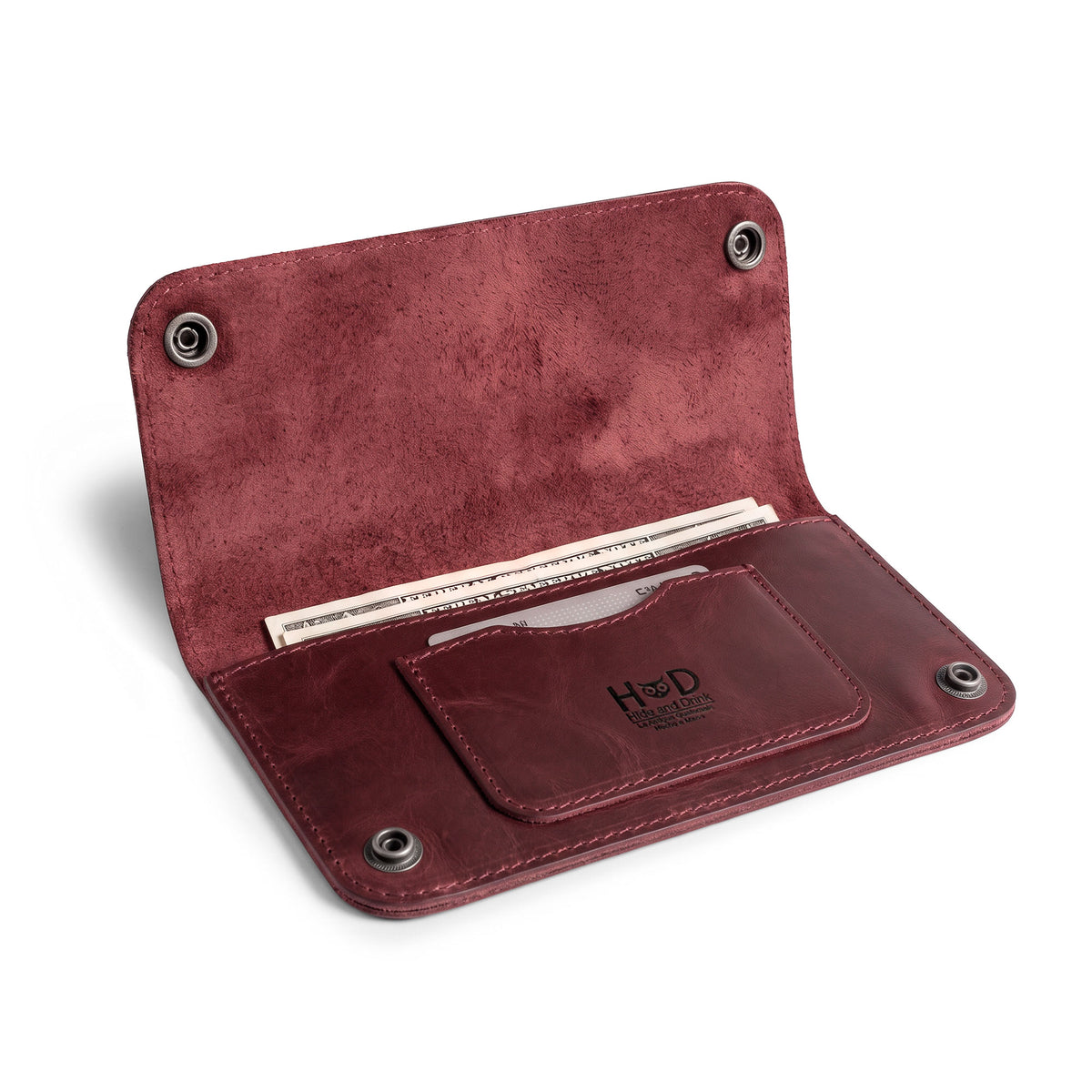 Open view of the Red Double Snap Folio Wallet by Hide & Drink, showcasing its design for secure cash and card storage. This full grain leather wallet is a stylish rectangular flat bill holder with card slot, ideal for use as a night bag or travel accessory, artisan crafted in La Antigua Guatemala & Oaxaca Mexico.