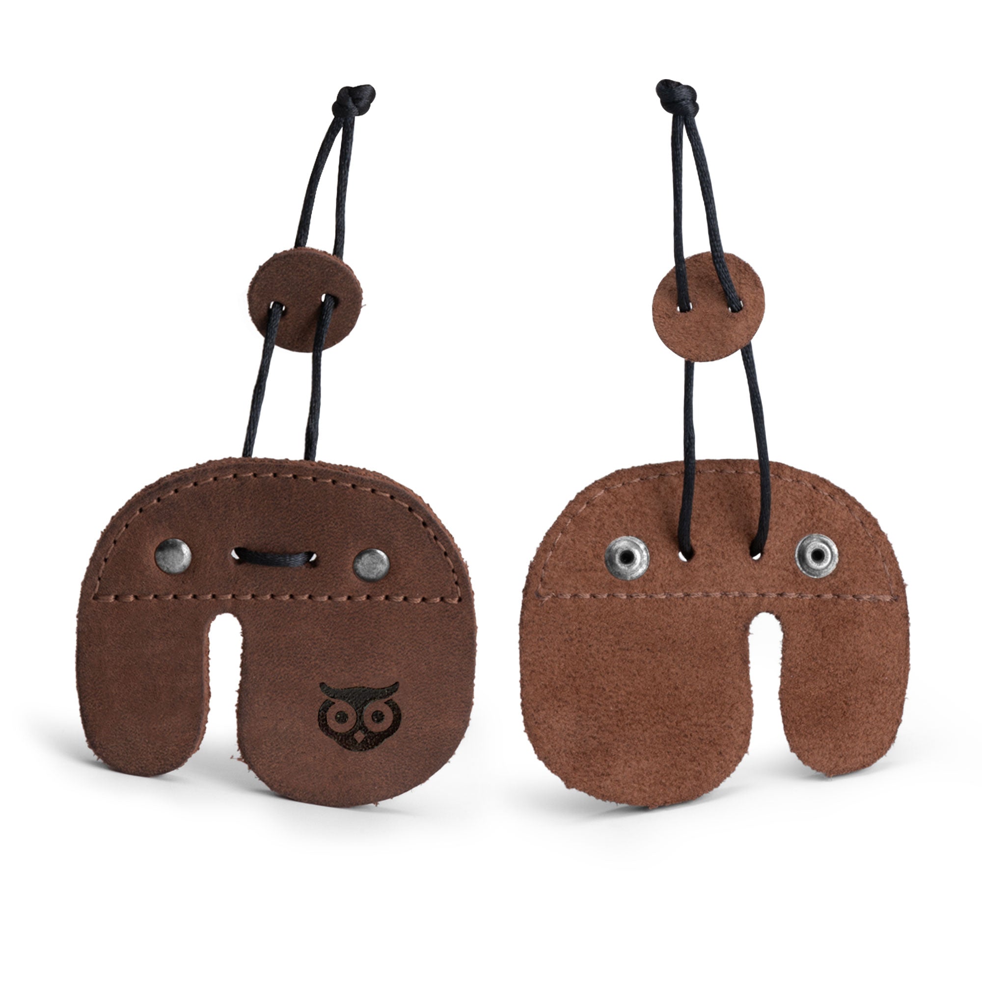 Right Handed Archery Finger Protector from Hide & Drink displayed in a stylish, handcrafted design. This Archery Finger Tab is made of quality Full Grain Leather, perfect for protecting fingers during shooting practice with recurve bows. A part of the handmade tradition in La Antigua Guatemala & Oaxaca Mexico, it reflects Small Batch Production, Hand Cut, Hand Sewn craftsmanship, and an artisan touch.