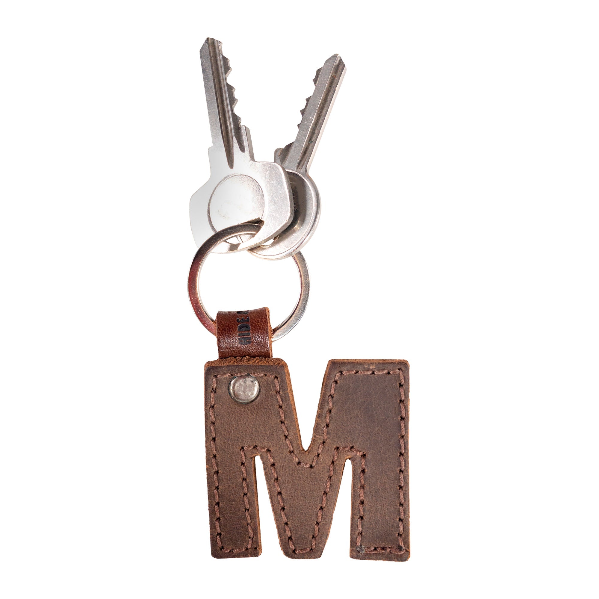 Stylish 'U' thick leather Alphabet Letter Keychain from Hide & Drink, perfect for adding a personalized touch to your key collection. Handcrafted in La Antigua Guatemala.