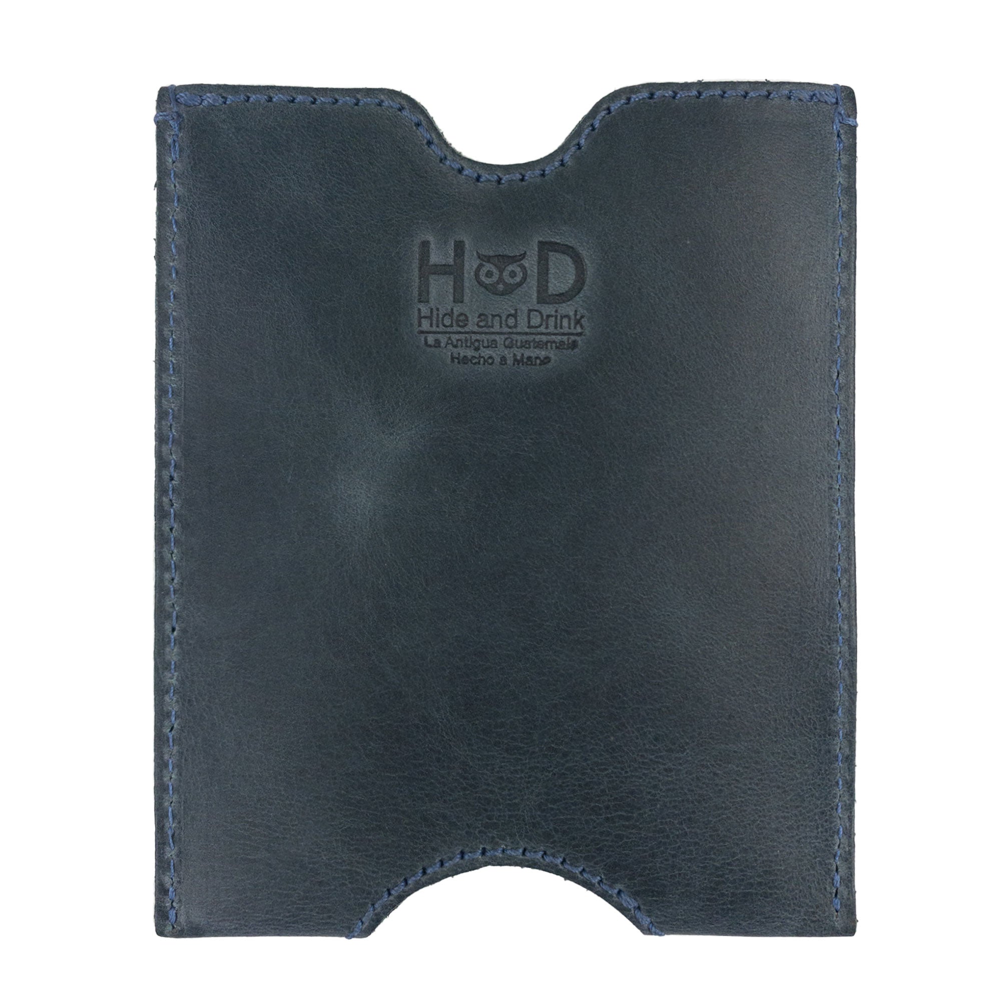 The Hide & Drink Passport Sleeve, a handmade travel passport pocket sleeve crafted from full grain leather, showcasing a sleek design. This artisan piece is fire branded and a perfect blend of style and functionality. Features tags: Travel Passport Pocket Sleeve, Full Grain Leather, StockyardX, Small Batch Production, Hand Cut, Hand Sewn, Fire Branded, Artisan, Handmade in La Antigua Guatemala & Oaxaca Mexico.