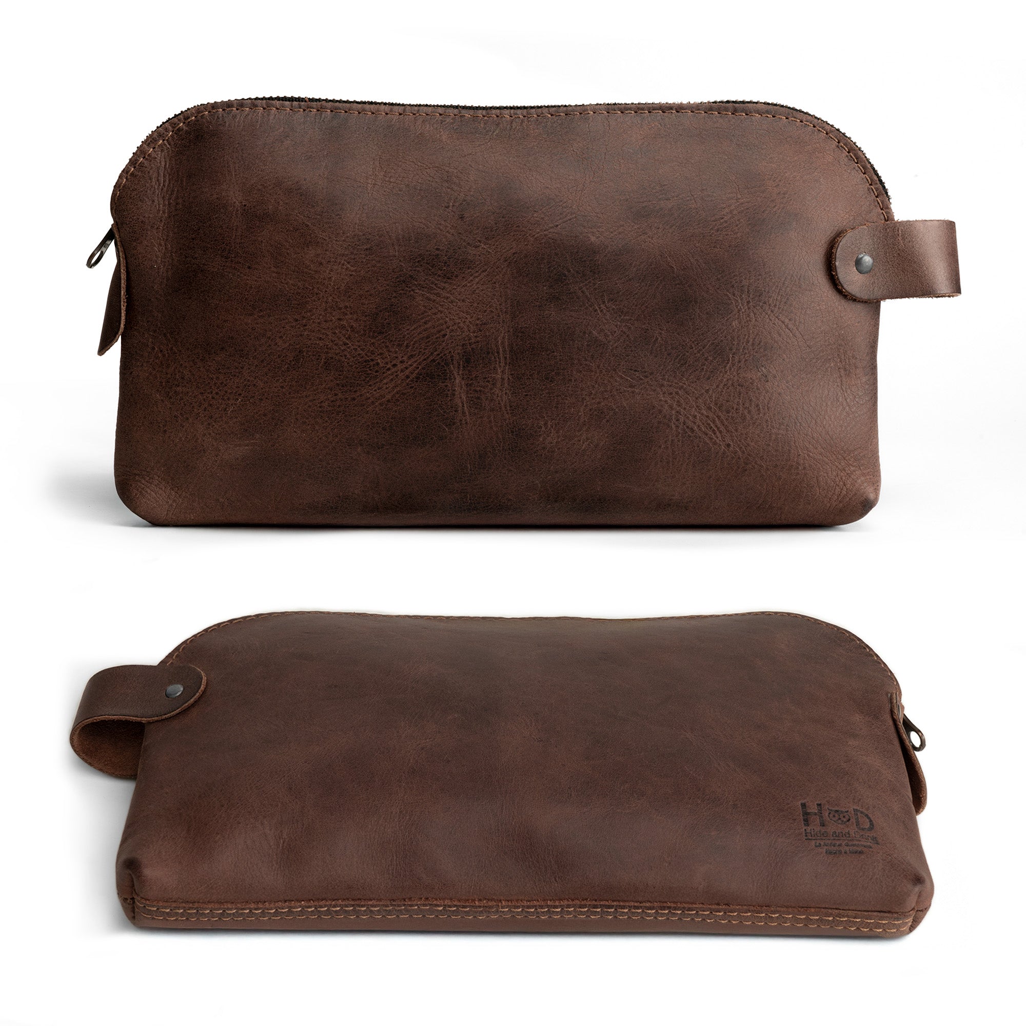 Dopp Kit Utility Bag by Hide & Drink featuring a side view of a rustic Dopp Kit Utility Bag perfect for travel or as a multi-purpose bag. This bag is crafted from full grain leather, highlighting small batch production, hand cut, hand sewn, and fire branded artisan techniques, made in La Antigua Guatemala & Oaxaca Mexico.