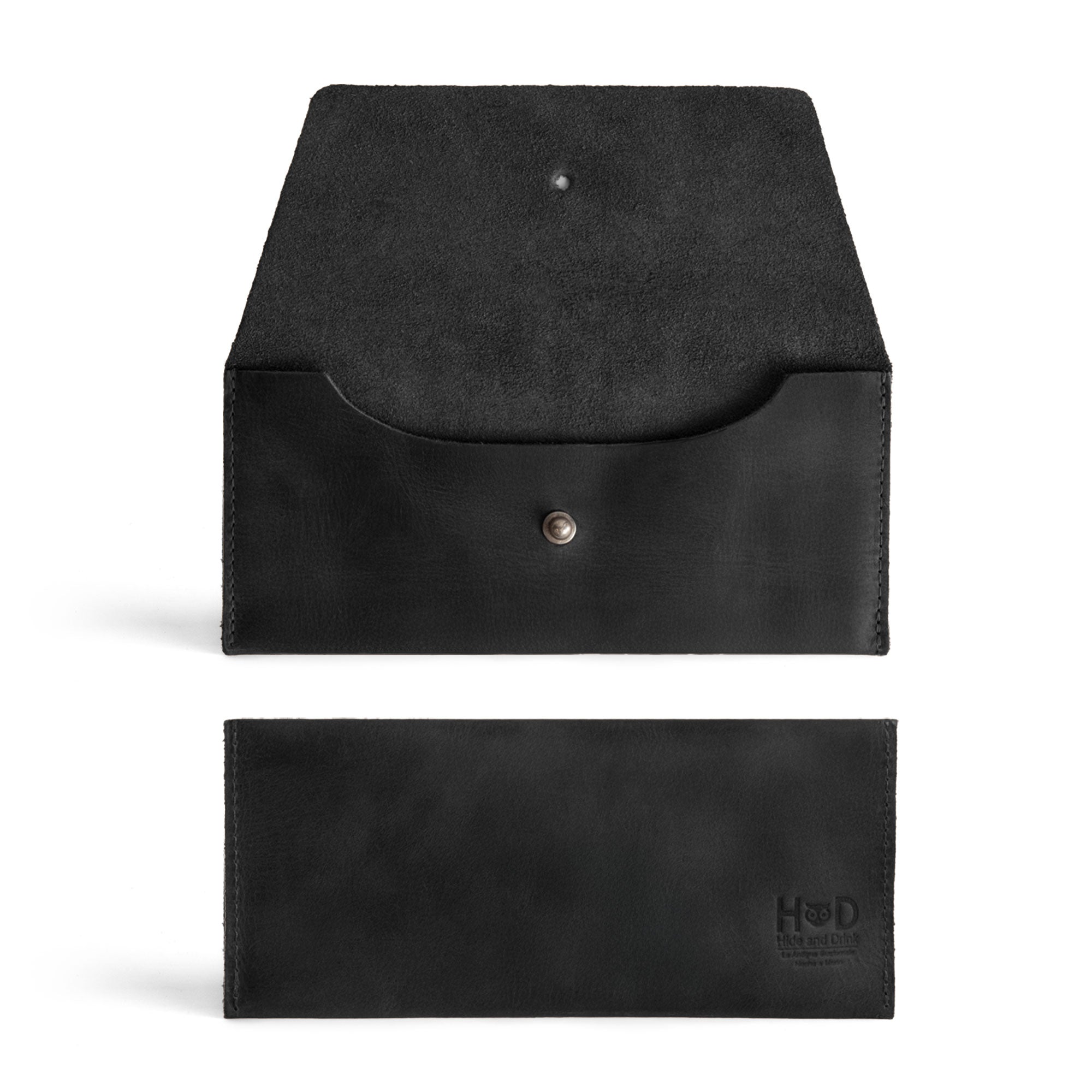 Interior view of the Long Utility Pouch in black leather by Hide & Drink, featuring soft suede lining. The minimalist design is perfect for holding essentials like cash and cards.