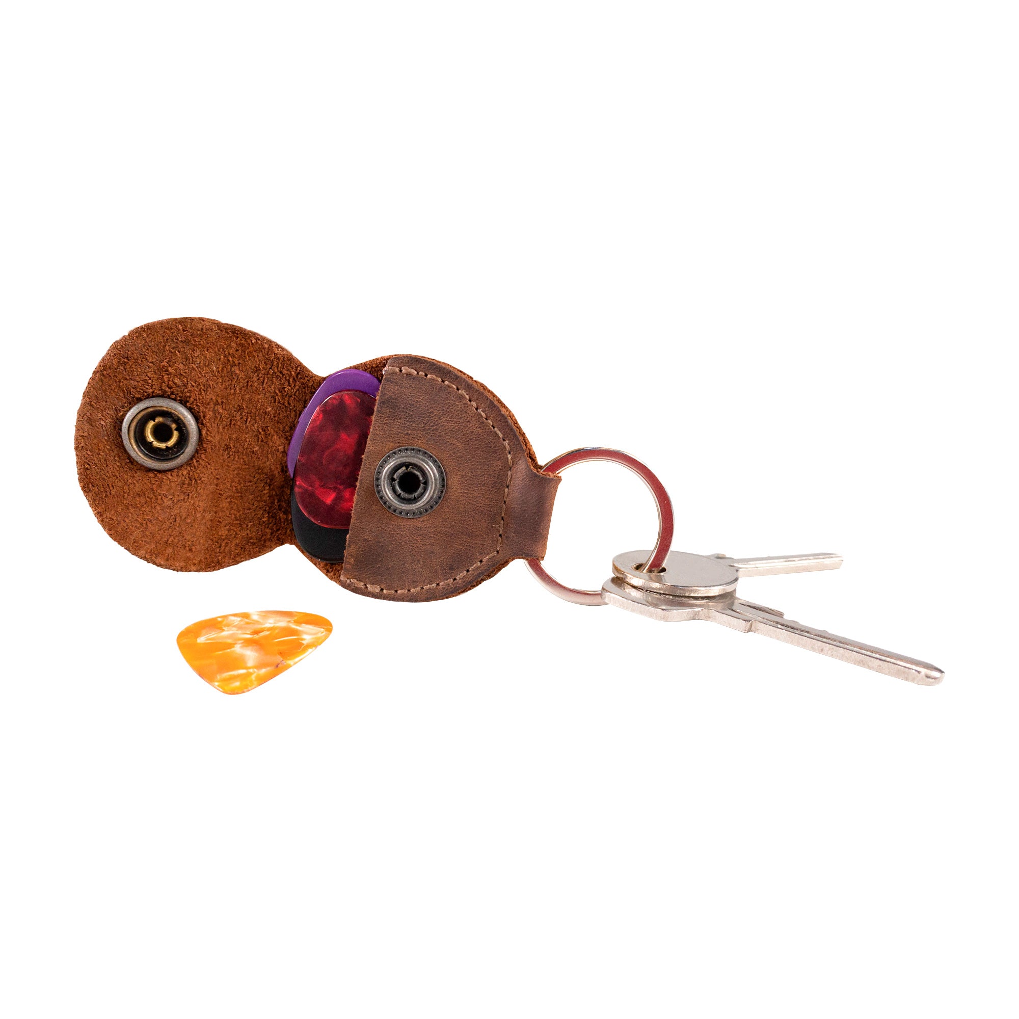 An open view of the Key Chain & Guitar Pick Holder by Hide & Drink, illustrating its practical Guitar Pick Holder with Ring and key organization capabilities. This stylish piece is crafted from Full Grain Leather, showcasing small batch production by artisans who hand cut and hand sew each item, handmade in La Antigua Guatemala & Oaxaca Mexico.