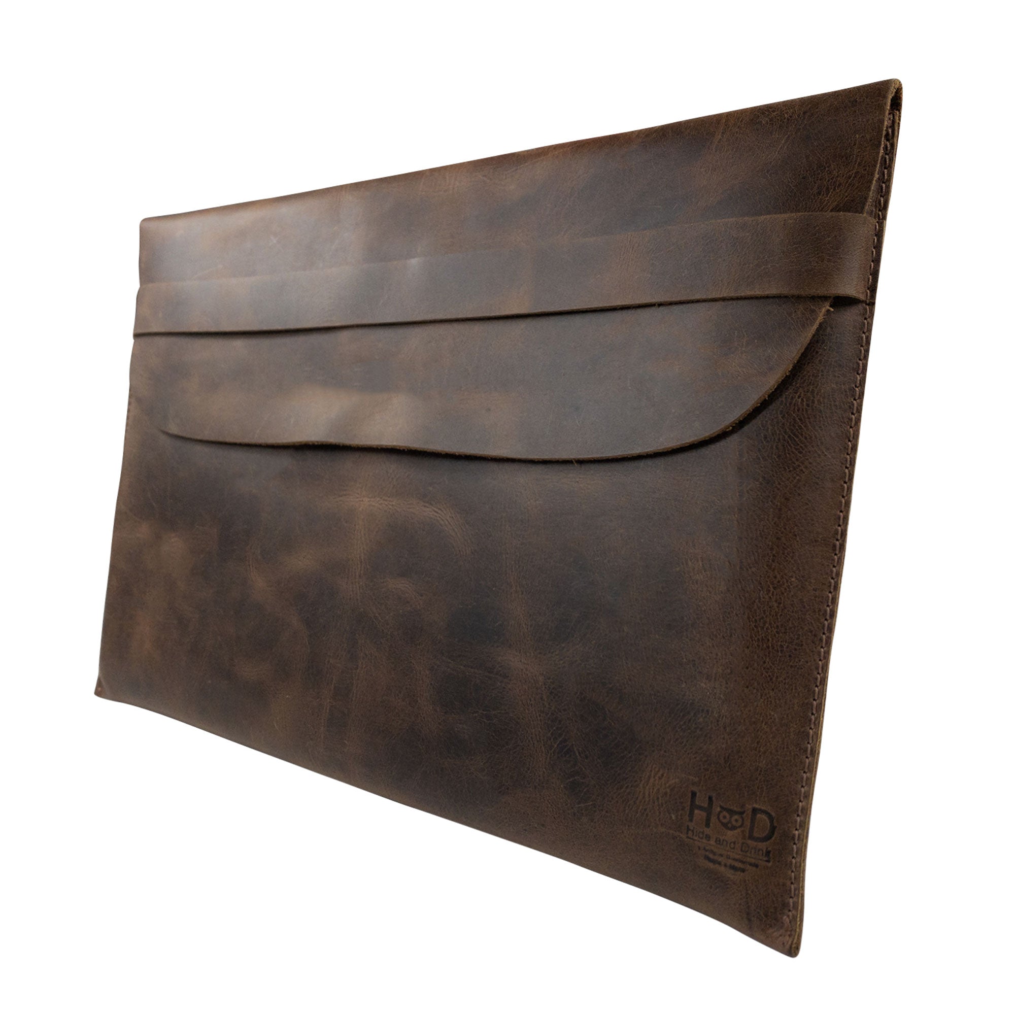 Handmade MacBook Slim Case by Hide & Drink showcasing rustic full grain leather, perfect for MacBook Air/Pro 13 Inch with M1 Chip. This artisan piece features hand cut, hand sewn details ensuring durability. StockyardX small batch production adds charm to this protective and stylish case.