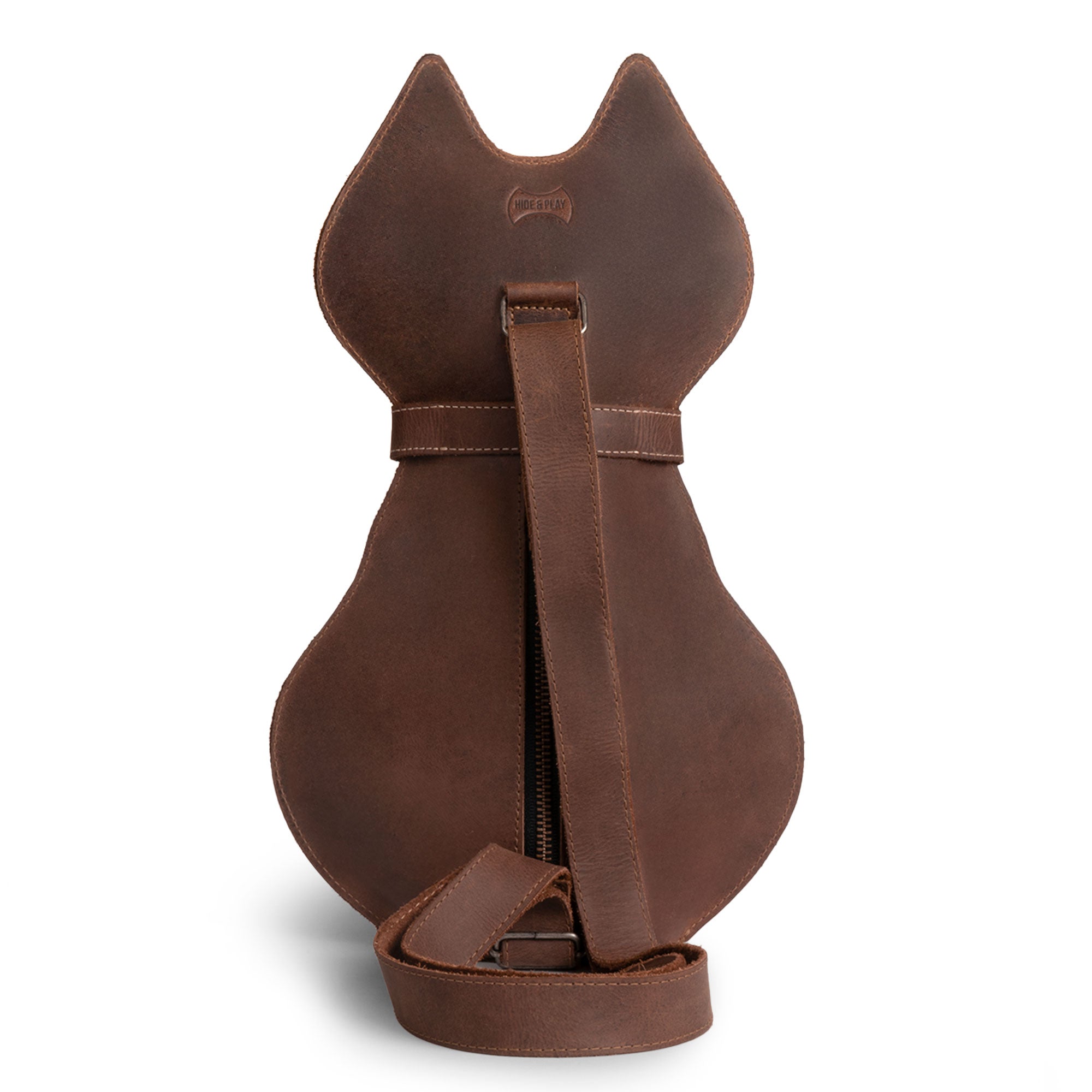 Close-up of the Kitty Shape Backpack by Hide & Play, made from durable full grain leather. This unique backpack is perfect for pet lovers who value style and functionality, suitable for travel and daily activities. Handmade in La Antigua Guatemala with attention to fire branded details.