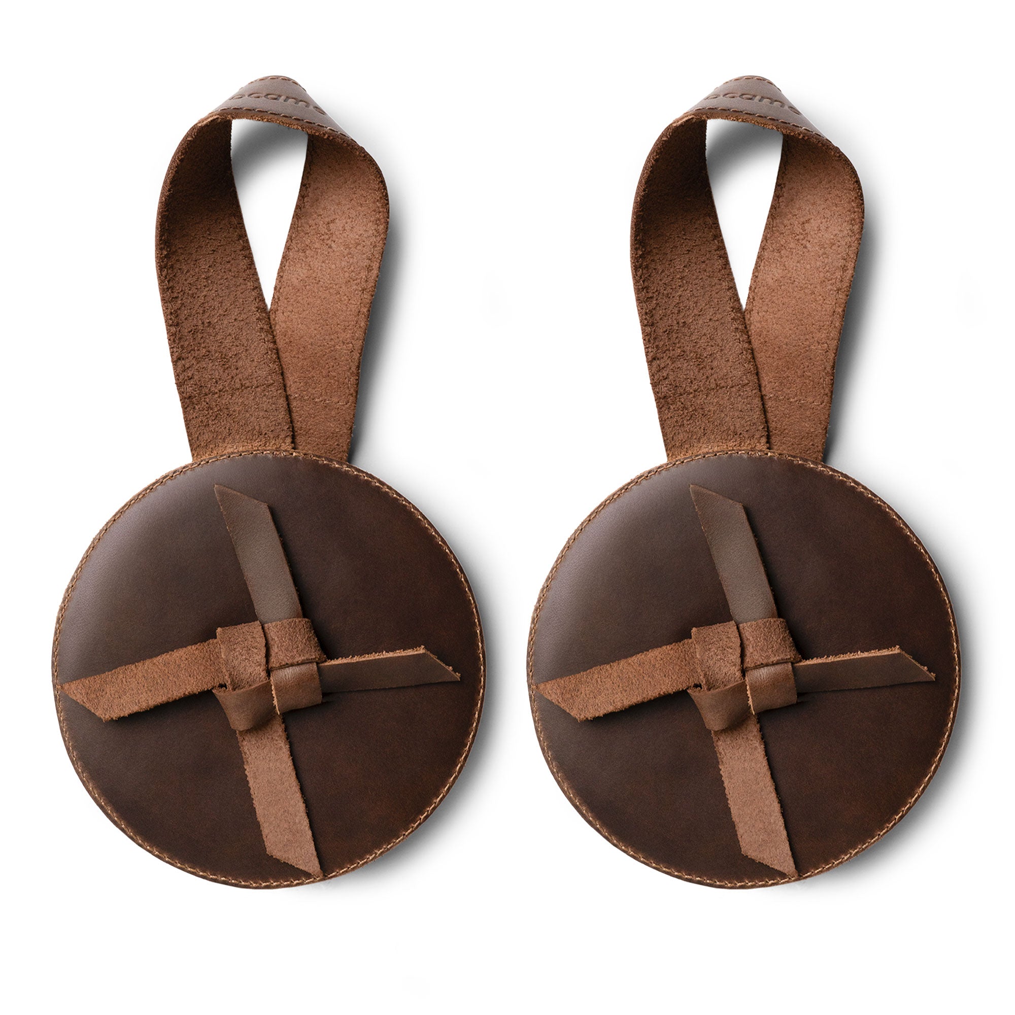 Handcrafted Set of 2 Cymbal Pads by tocame, highlighting an attractive circular design with straps. Ideal for percussion musicians, these full grain leather pads ensure comfort during play. Artisan quality from hand cut and sewn craftsmanship in La Antigua, Guatemala.