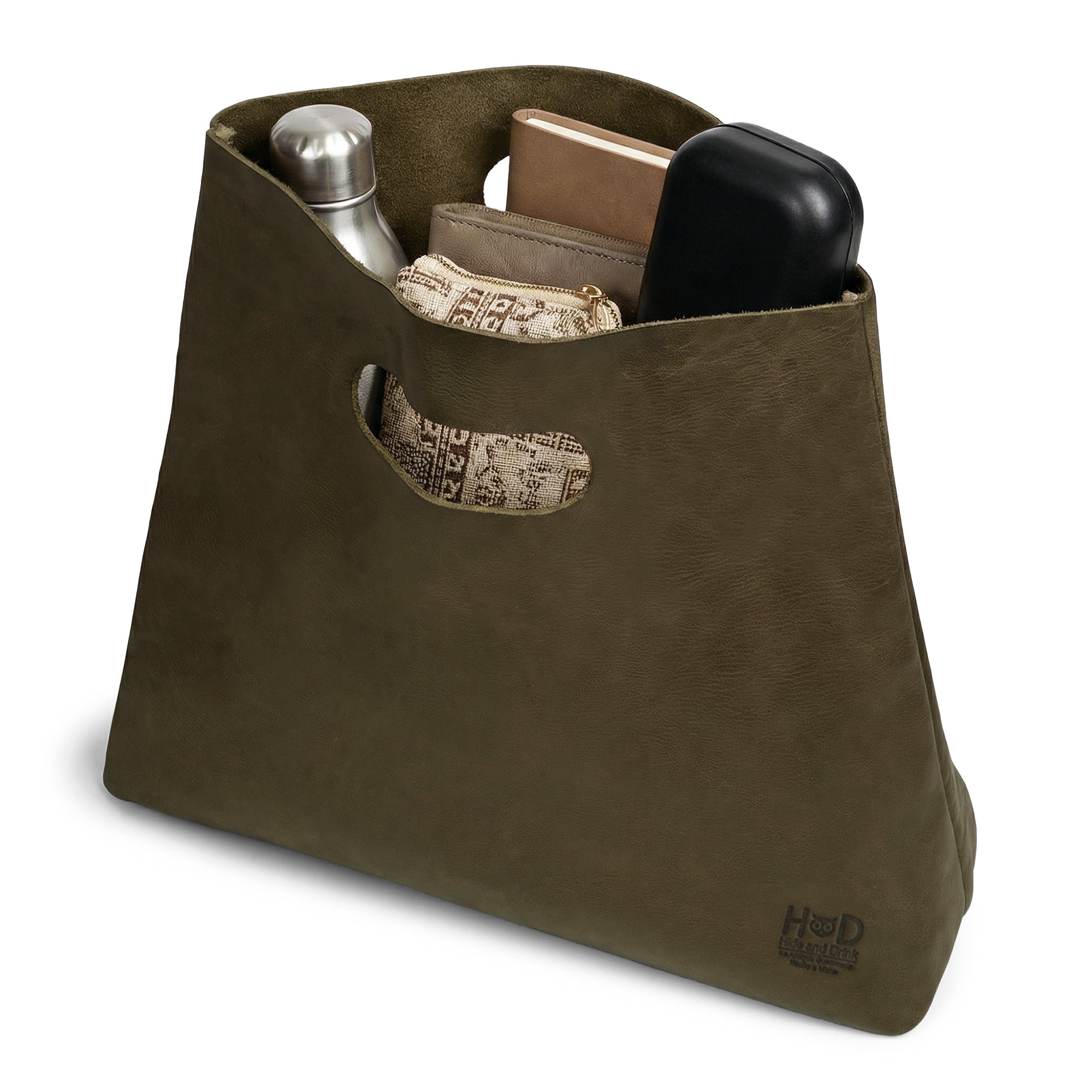 Detail shot of the Minimalist Boho Handbag from Hide & Drink, highlighting the unique handle and interior design. Designed as a Rustic Purse or Shopping Bag, this Minimalist Handbag for Women is made from Full Grain Leather, emphasizing StockyardX's ethos of Small Batch Production and artisan quality, handcrafted in La Antigua Guatemala & Oaxaca Mexico.