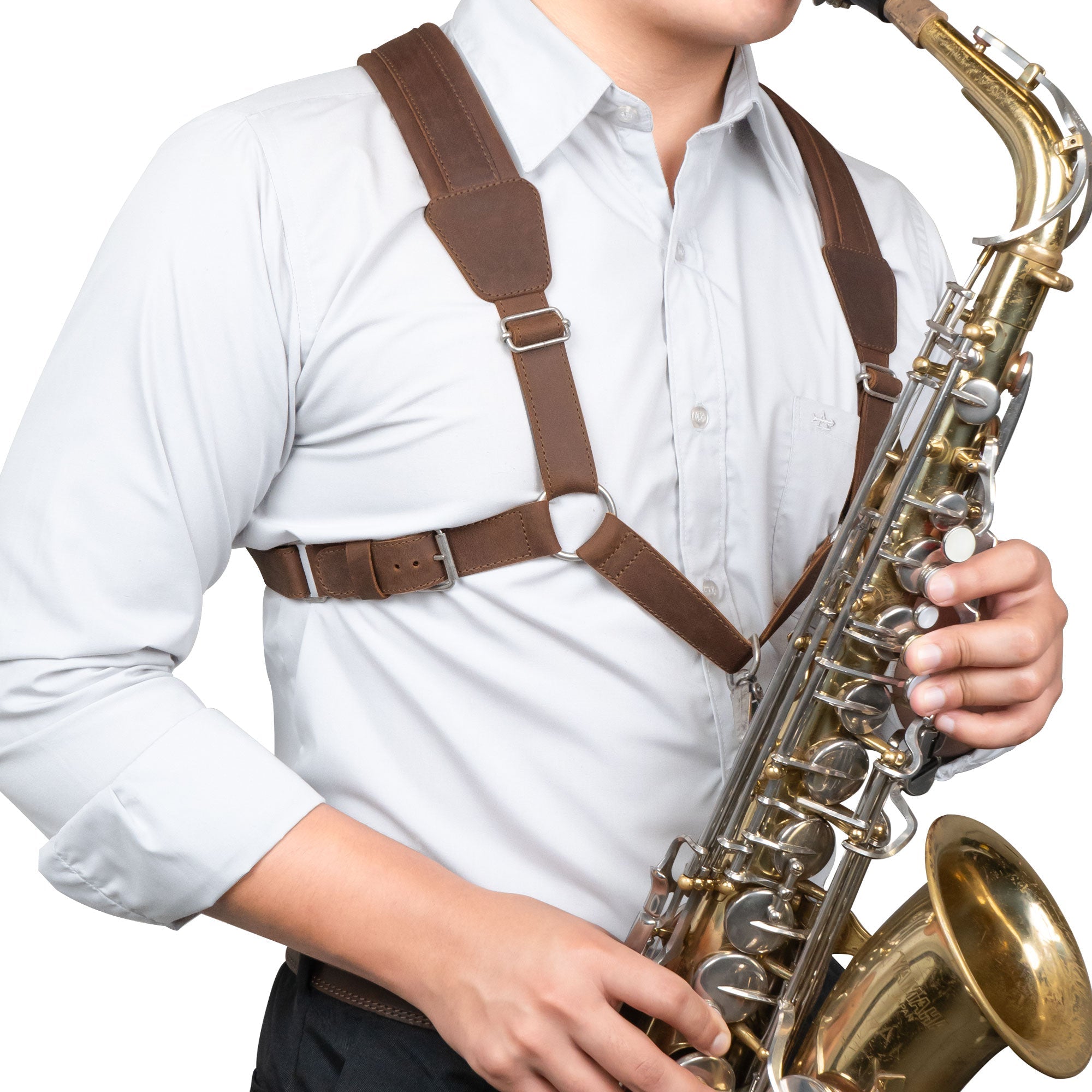 A saxophonist wearing the Ajustable Harness for Alto & Tenor Saxophone by tocame, demonstrating the comfort and practicality of this adjustable padded harness. Perfect for marching band essentials, it's crafted from full grain leather through small batch production, embodying the artisan quality of handmade goods from La Antigua Guatemala and Oaxaca Mexico.