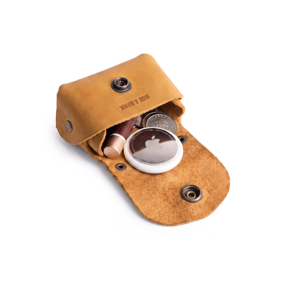 Front view of the mustard colored Tiny Handbag Keychain by Hide & Drink, illustrating its elegant Tiny Handbag with Key Ring Holder design crafted from Full Grain Leather. This unique item is part of Small Batch Production, and is Hand Cut, Hand Sewn, and Fire Branded, reflecting its Handmade beauty in La Antigua Guatemala & Oaxaca Mexico.