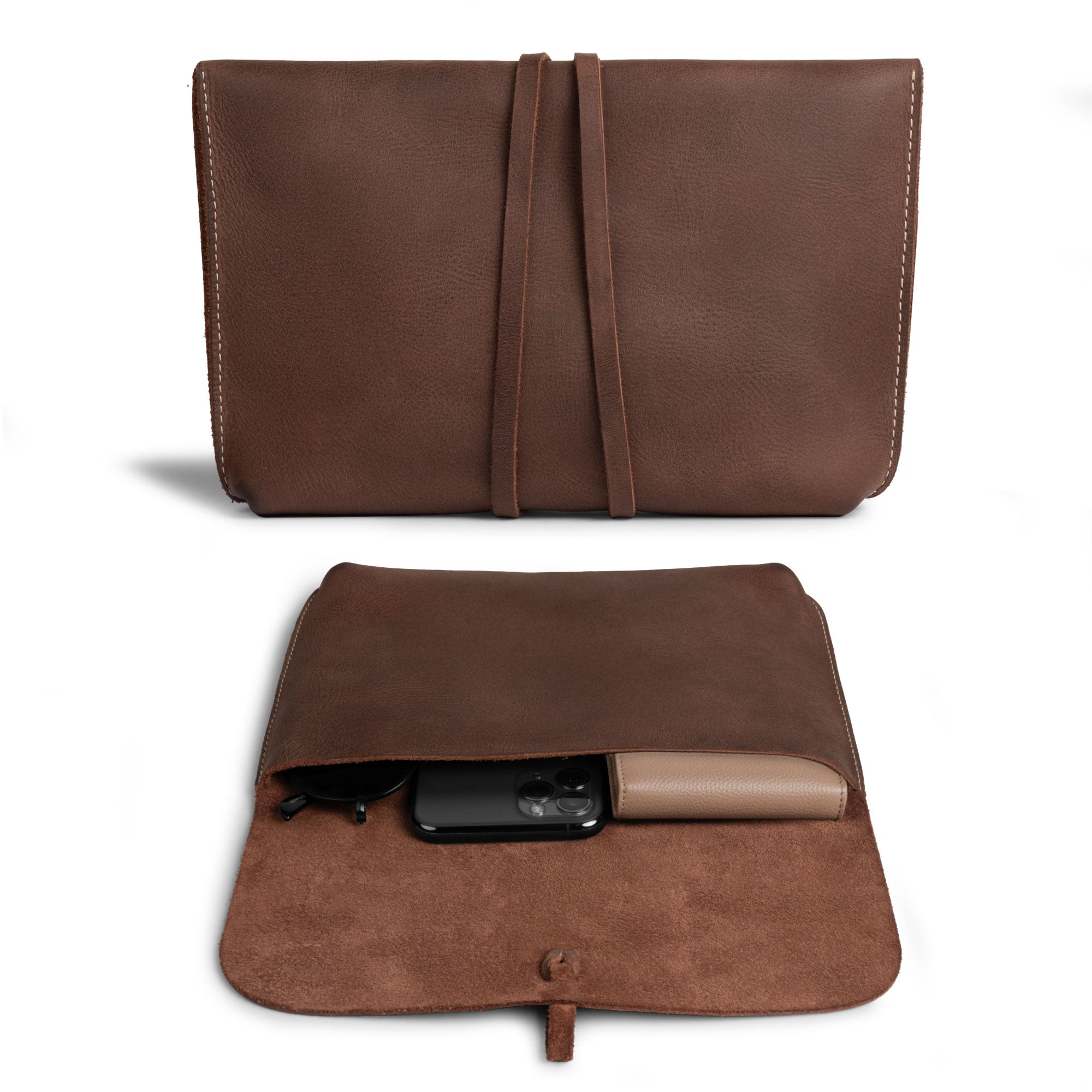 Interior view of Heather's Minimalist Clutch Bag featuring a soft suede lining. This artisan bag, made from full grain leather, is excellent for holding cards, money, and coins as well as makeup and toiletry items. Handmade in La Antigua Guatemala & Oaxaca Mexico, showcasing small batch production.