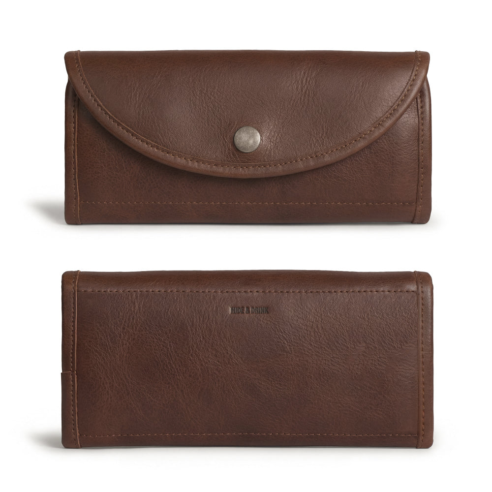 Exterior of the Single Snap Zippered Wallet by Hide & Drink, highlighting its rustic full grain leather design. This Snap Clutch Wallet for Women serves as a stylish money holder and card organizer with a zippered pouch, crafted in small batches and handmade in La Antigua Guatemala.