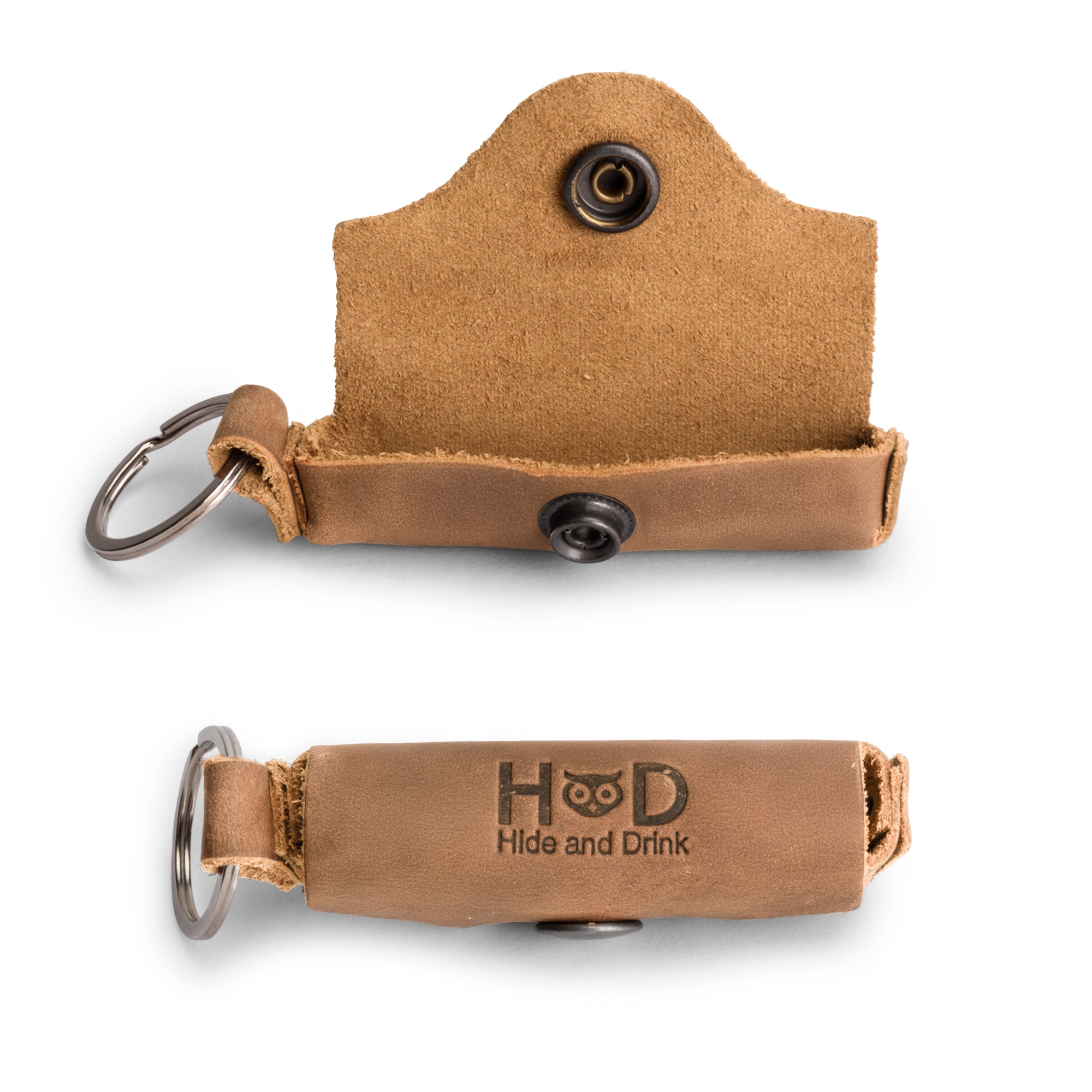 Inside view of the Rustic Leather Lip Balm Key Chain by Hide & Drink, highlighting its unique design and brass metal clasp. This handcrafted Lip Balm Key Chain holder is made from durable full grain leather, ensuring effective lip protection, and is artisan crafted in La Antigua Guatemala with a classic vintage look.