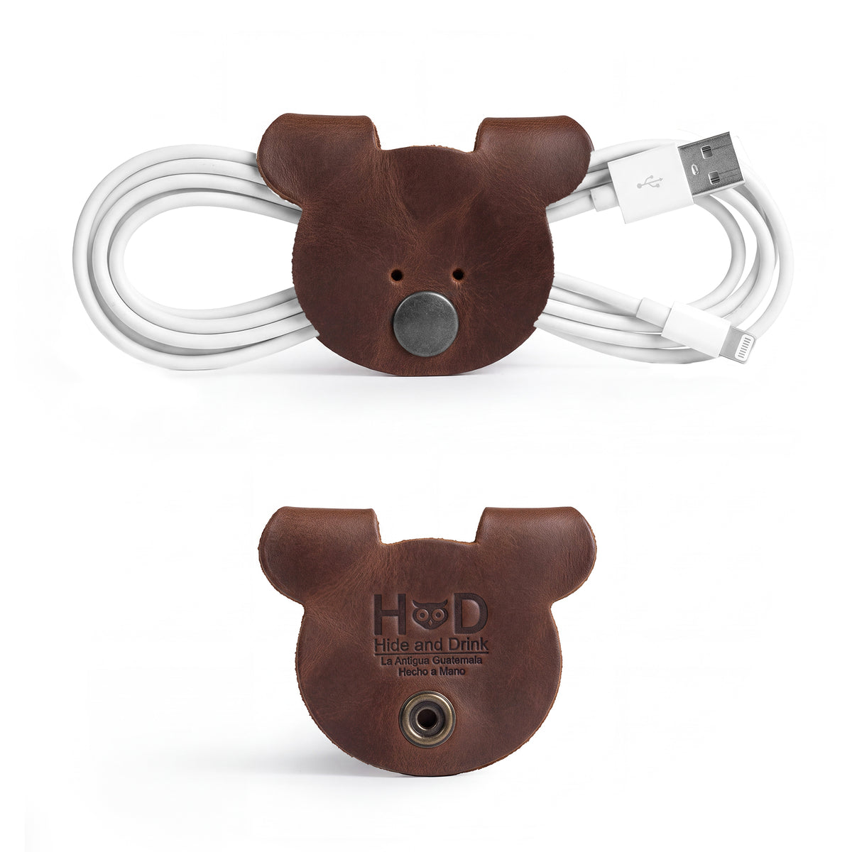 Back view of darker Bear Shaped Cord Keepers (Cord Clam) by Hide & Drink, showcasing fire branded details and the quality Full Grain Leather. Artisan crafted in La Antigua Guatemala & Oaxaca Mexico, representing small batch production.