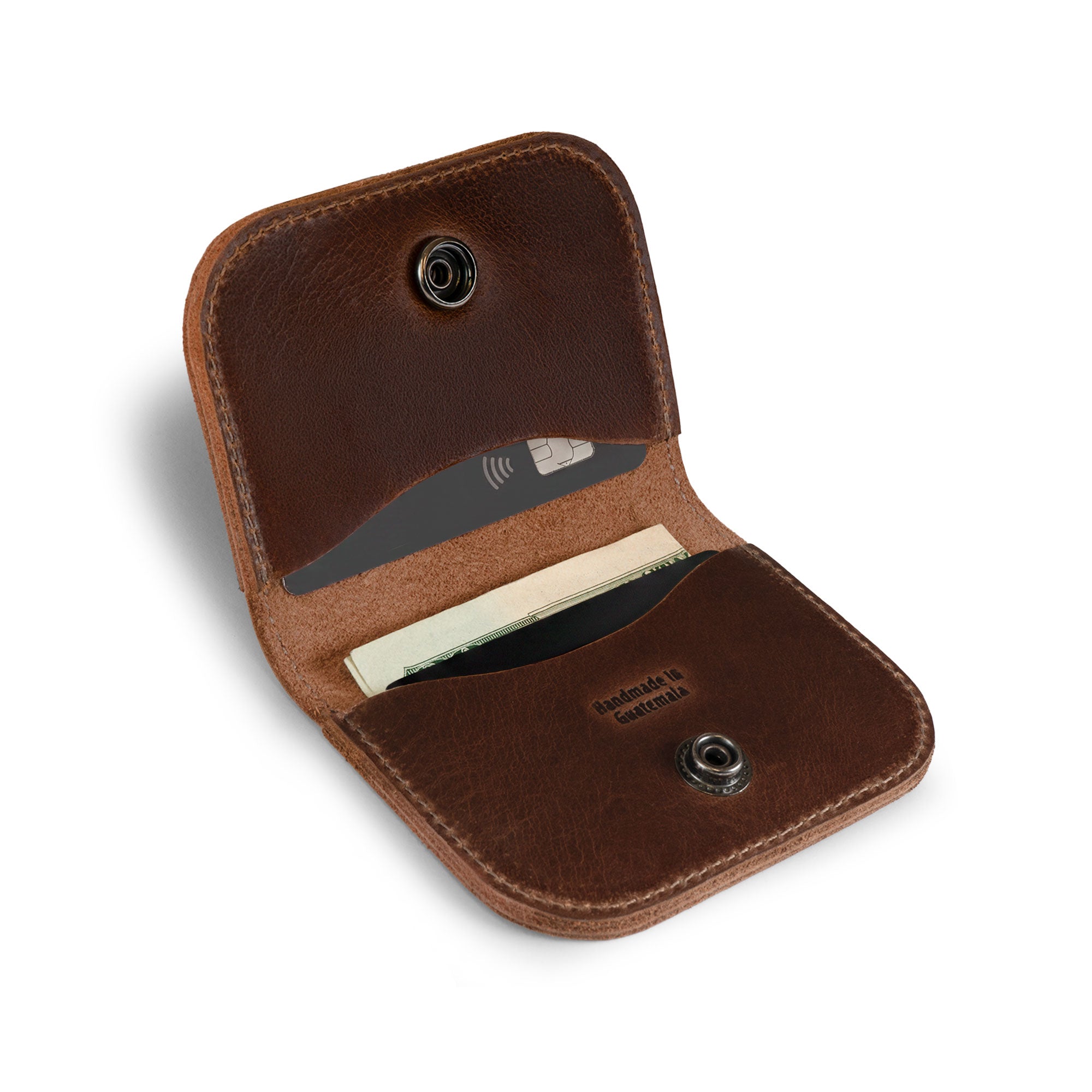 Open Austin Genuine The Magnolia Card Wallet displaying card and cash compartments with snap closures. This Full Grain Leather wallet reflects StockyardX Small Batch Production, Hand Cut and Hand Sewn craftsmanship, Fire Branded Artisan details, and is Handmade in La Antigua Guatemala & Oaxaca Mexico.